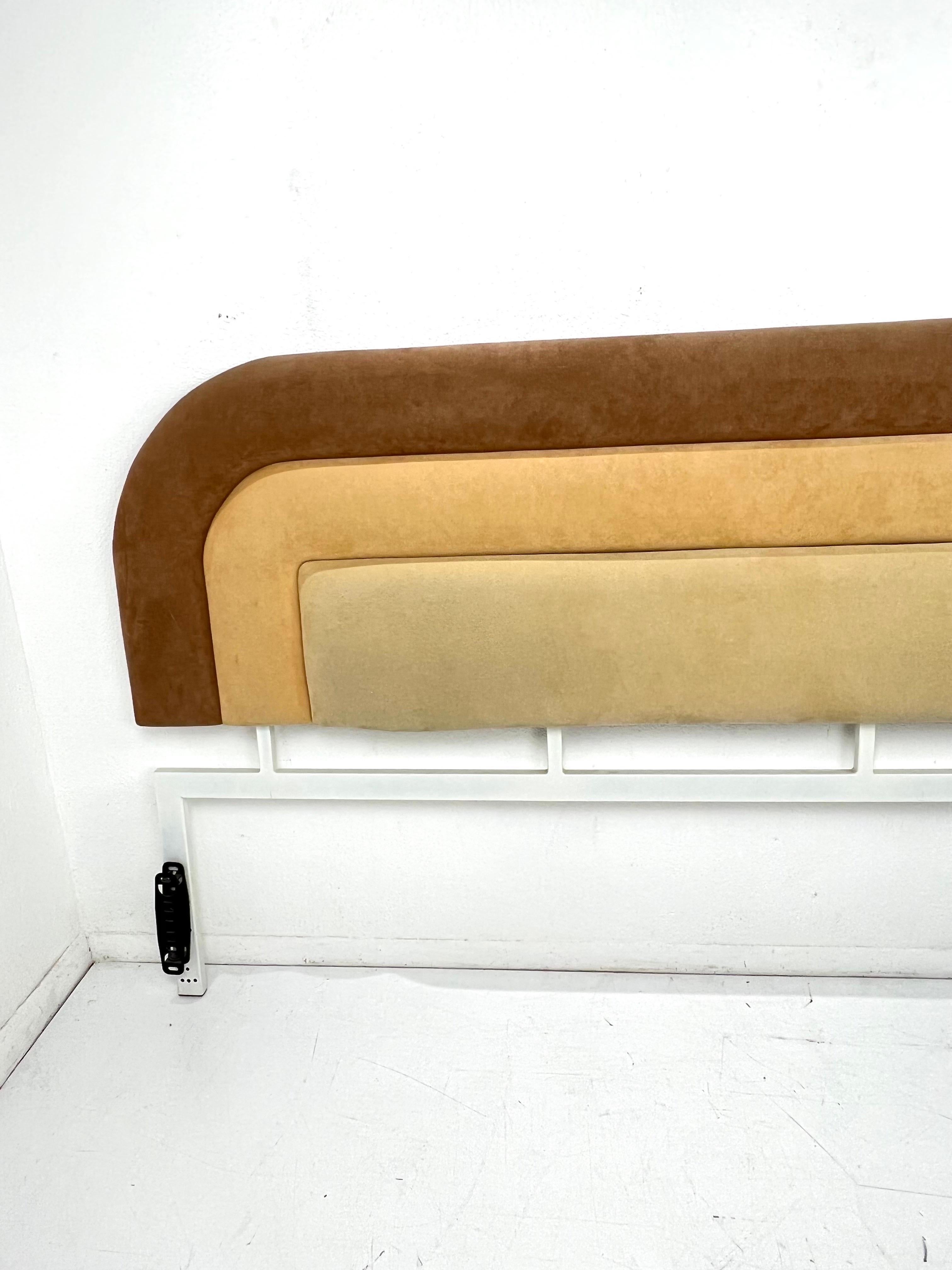 Postmodern upholstered king size headboard by Tri-Mark Designs in brown/tan gradient suede. Good condition with some scratches/scuffs due to age/use. 