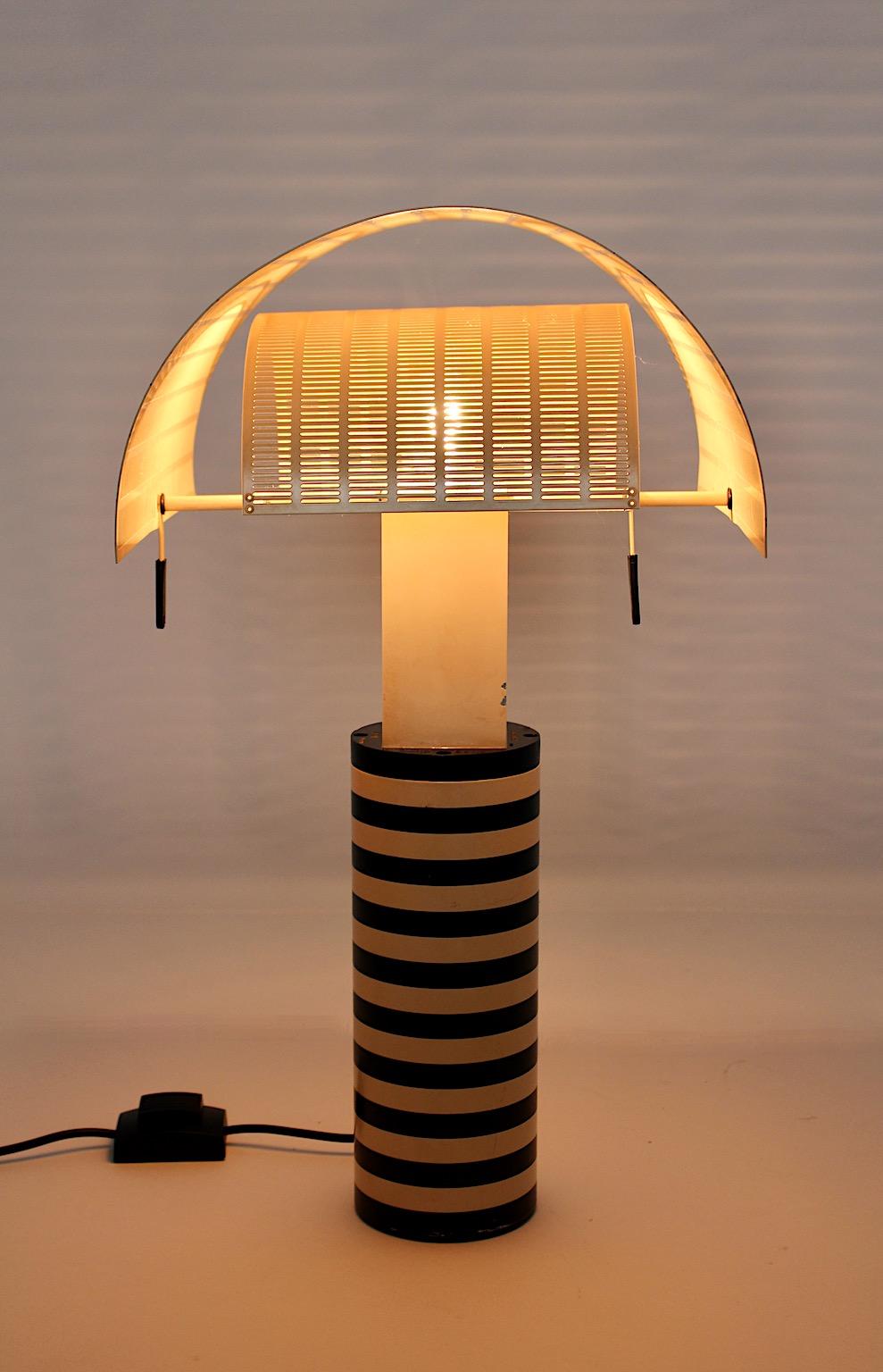 Postmodern vintage table lamp by Mario Bott in black and white color from plastic and metal circa 1986, Italy.
An iconic table lamp, model Shogun, designed by Mario Botta for Artemide 1986 Italy.
Mario Botta ( 1943 ) Swiss architect and