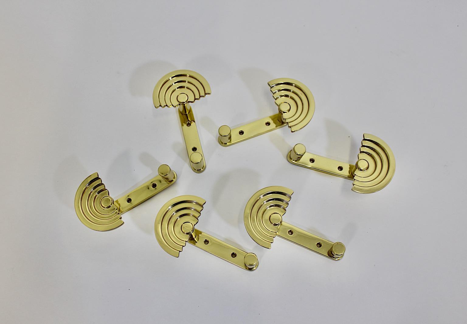 Post Modern vintage six ( 6 ) coat hooks from brass by Ettore Sottsass SE 314 for Valli & Valli circa 1985 Italy.
A great set of six coat hooks from polished brass from the Post Modern period designed by Ettore Sottsass for Valli & Valli circa 1985