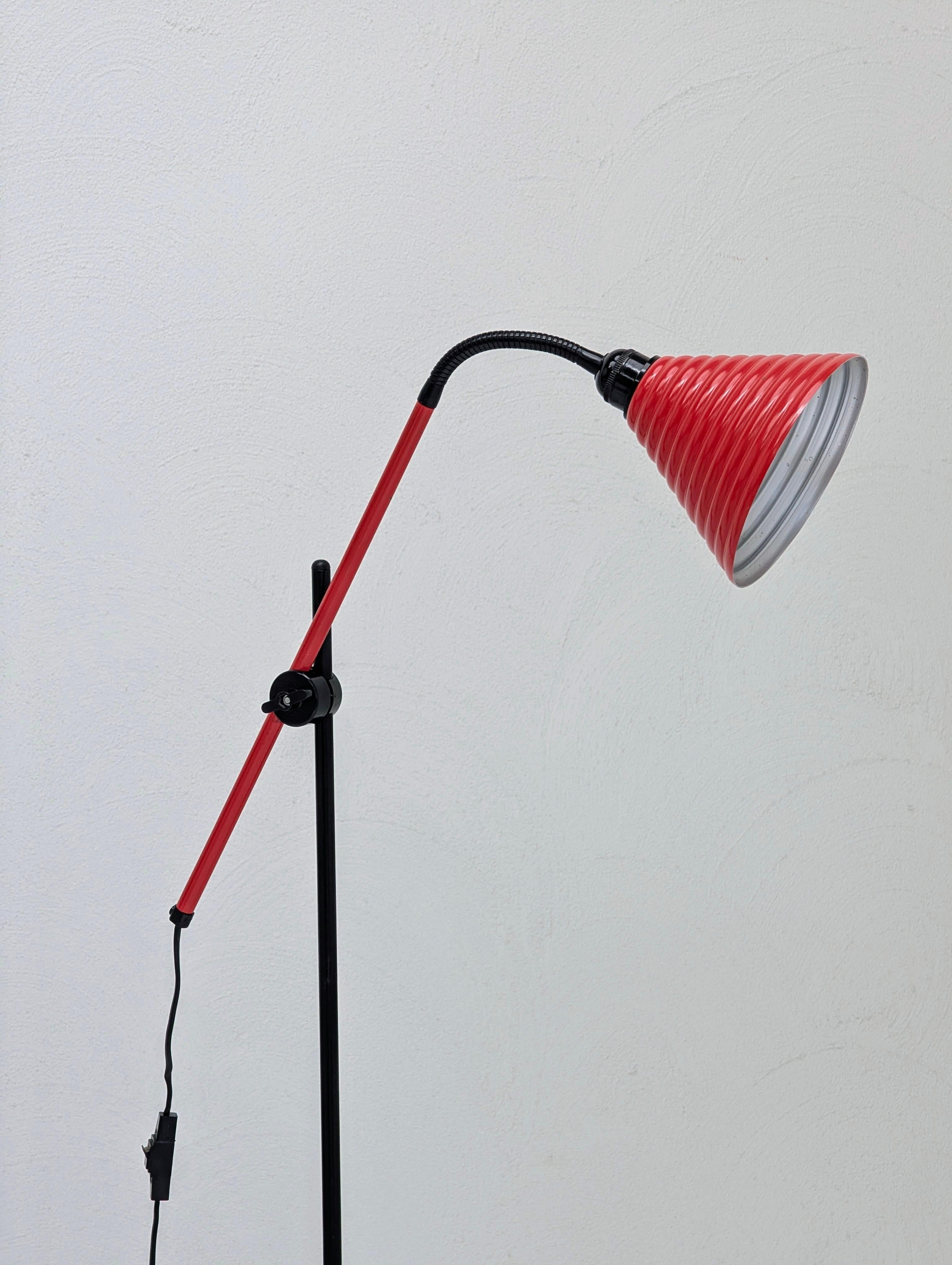 A striking example of 1980s Postmodern design, this vintage Australian floor lamp is the iconic 'Trix' by Melbourne-based company Regent.

The lamp's character is defined by its signature fluted aluminium shade, finished in a bold, original red,