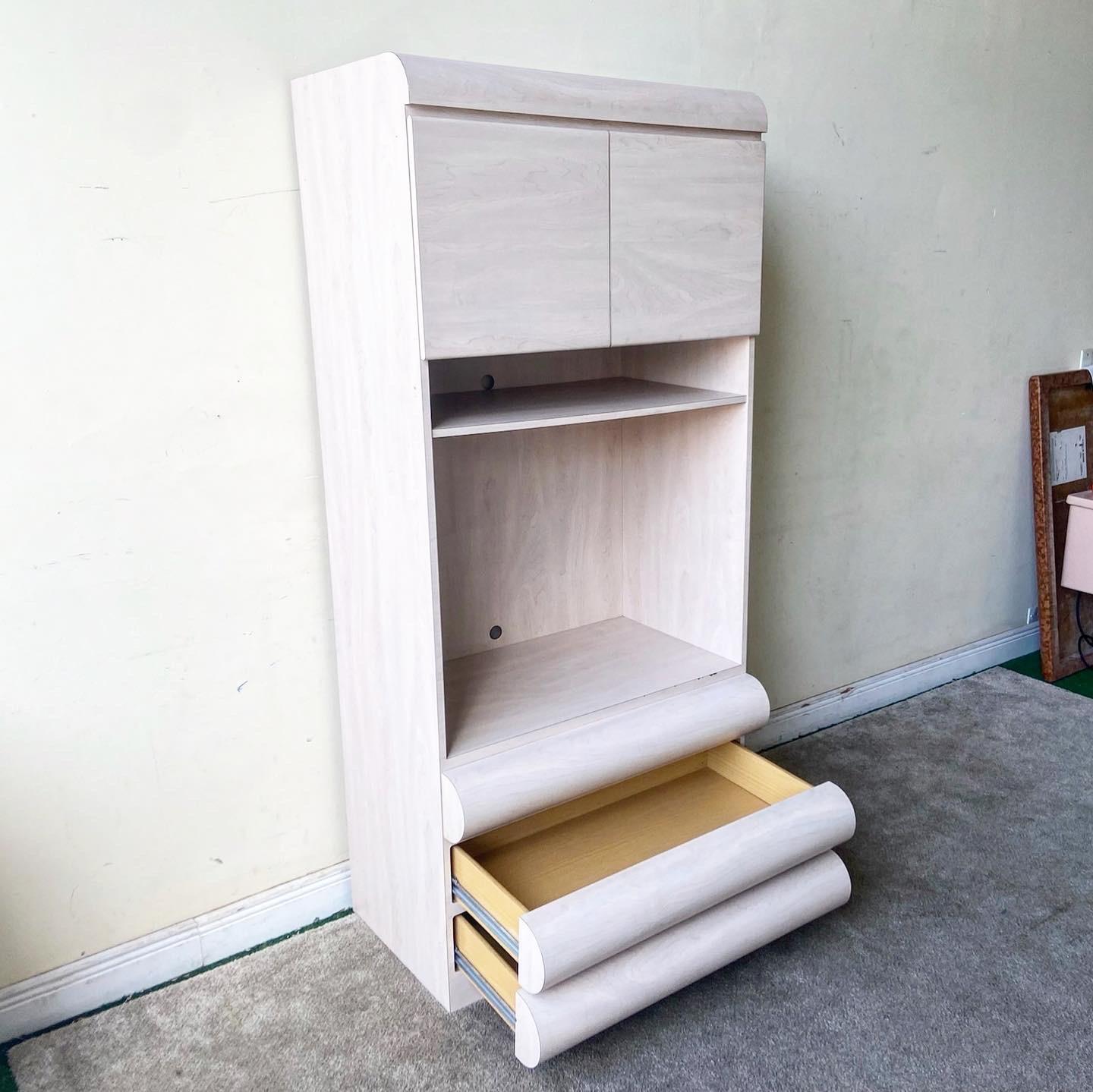 Amazing 1980s postmodern bullnose etagere. Features three spacious drawers with a large shelved open area, topped by a small cabinet section.
