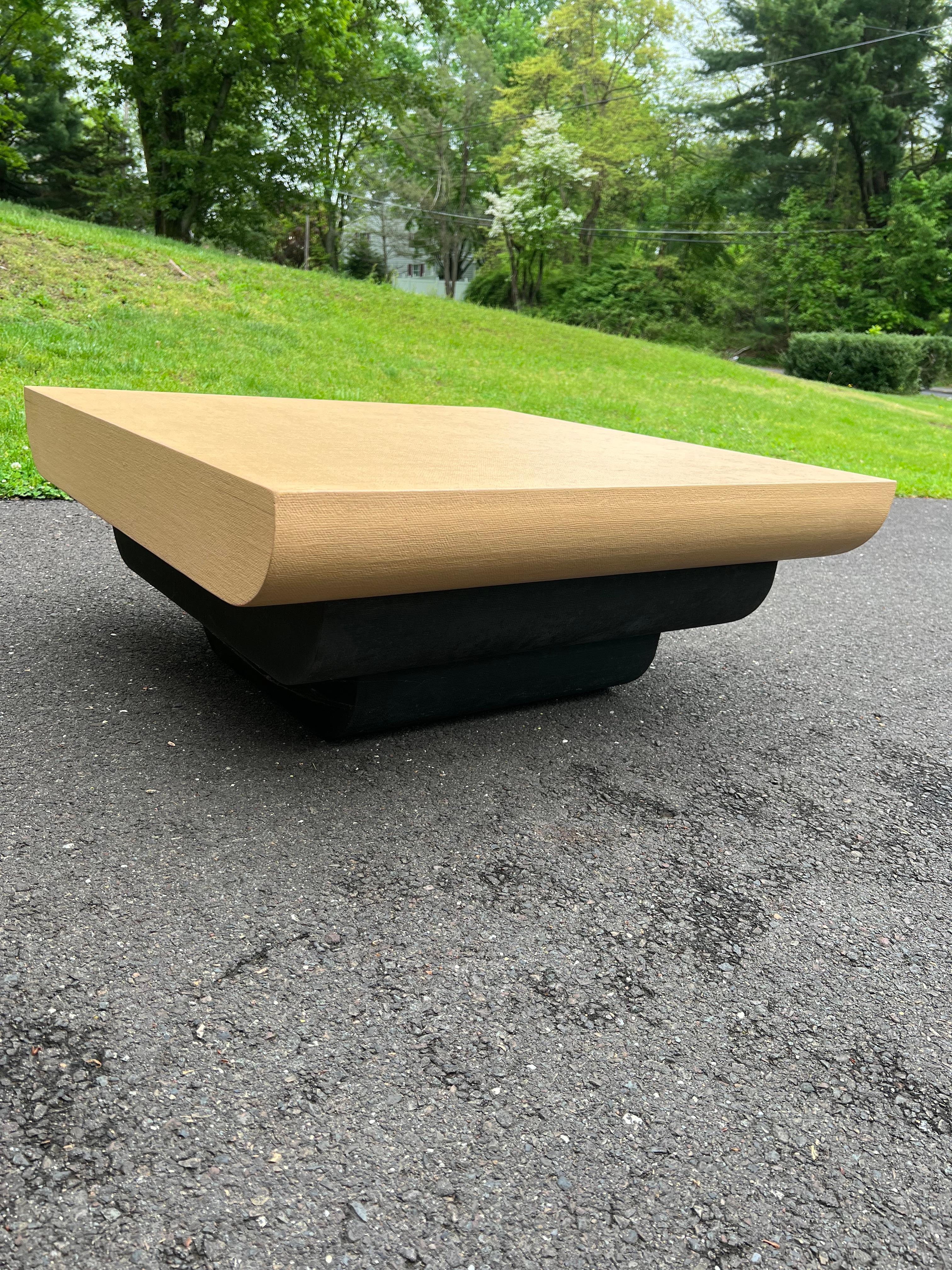 Peach waterfall cascade coffee table with black plinth custom made in 1980s

Couple brown paint marks on one side of the coffee table. Otherwise fantastic vintage condition