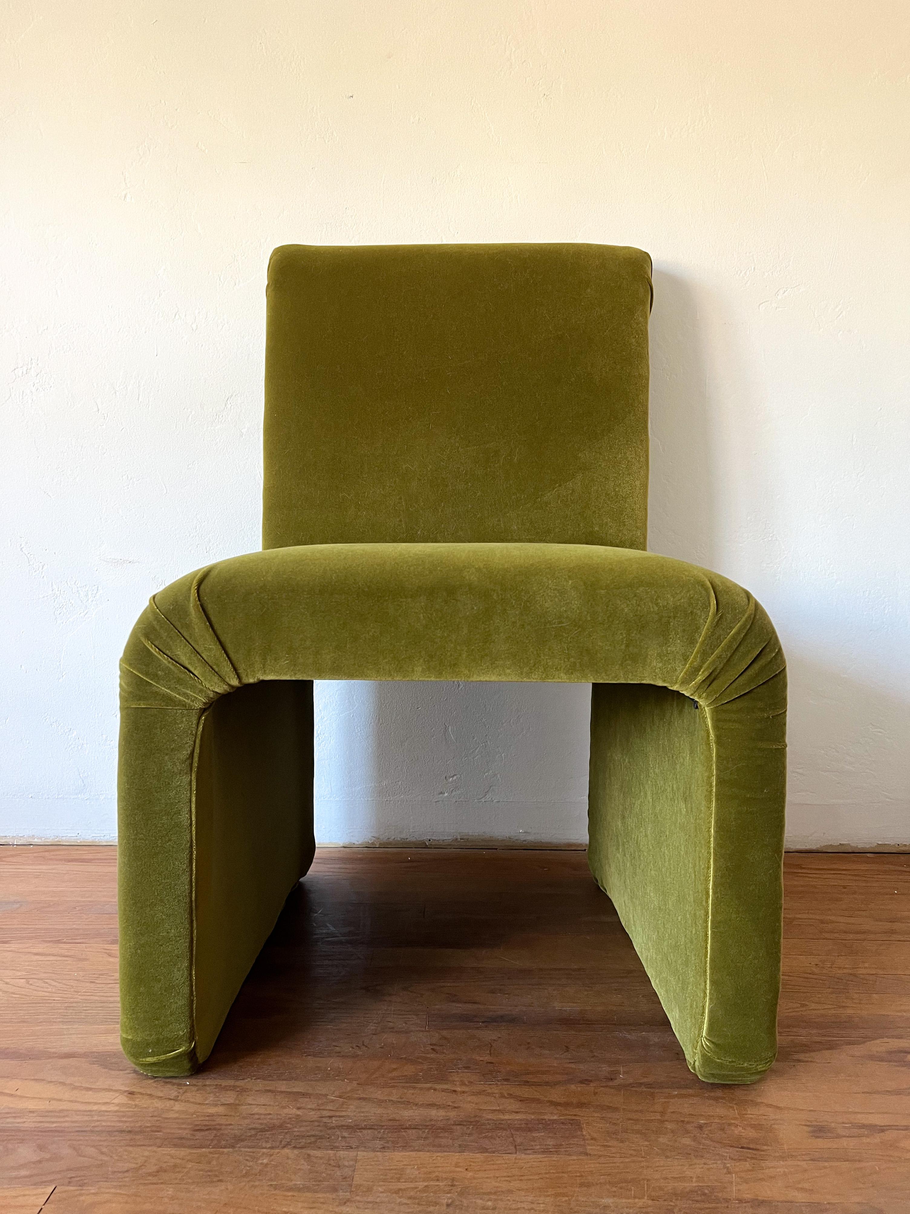 This is a newly reupholstered waterfall lounge chair in the style of legendary iconic furniture designer Karl Springer.  The fabric is a very soft and high quality velvet. Color is a rich moss. 