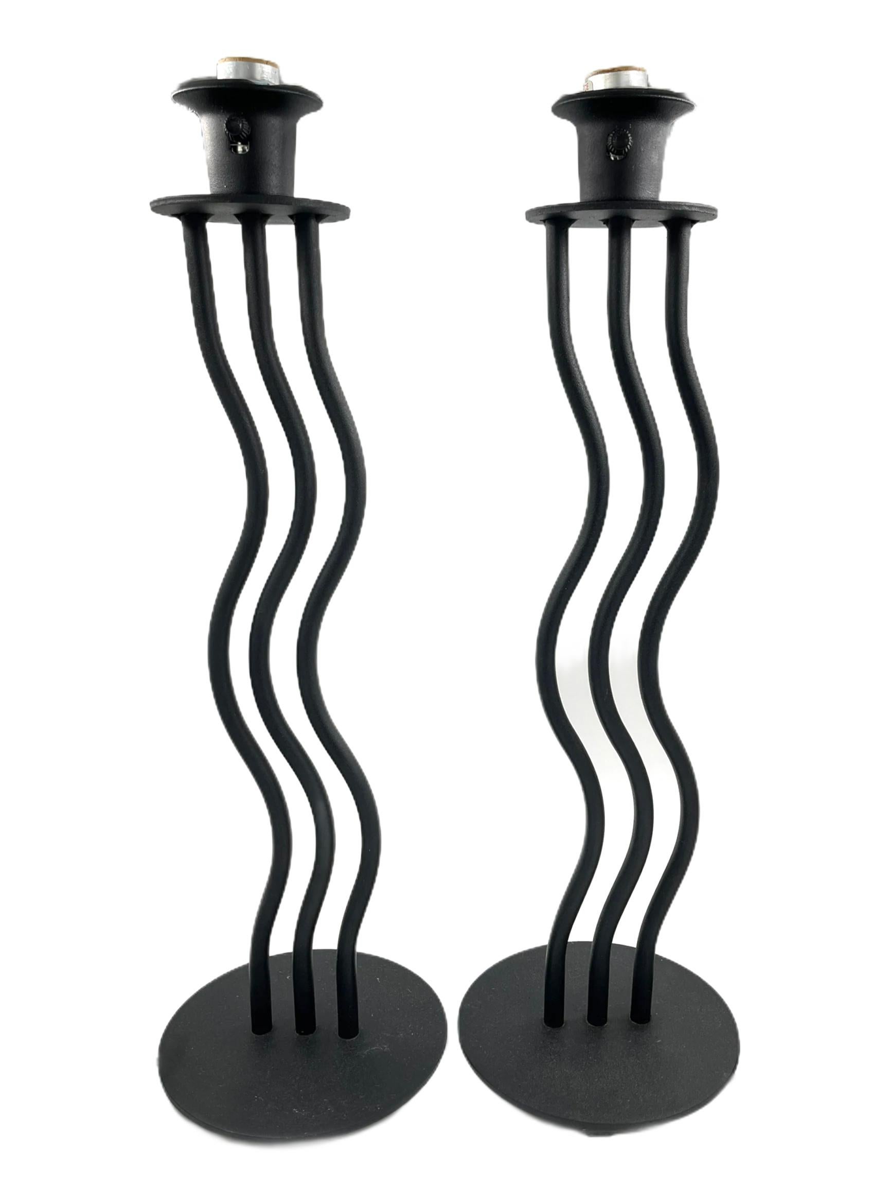 Iconic 80's black iron wave lamps with new clip on shades manufactured by Crosswell. Rewired, New shades.

New Danish designed, knife pleated Eclipse lampshade. It is manufactured using traditional techniques, machinery and expertise to produce a
