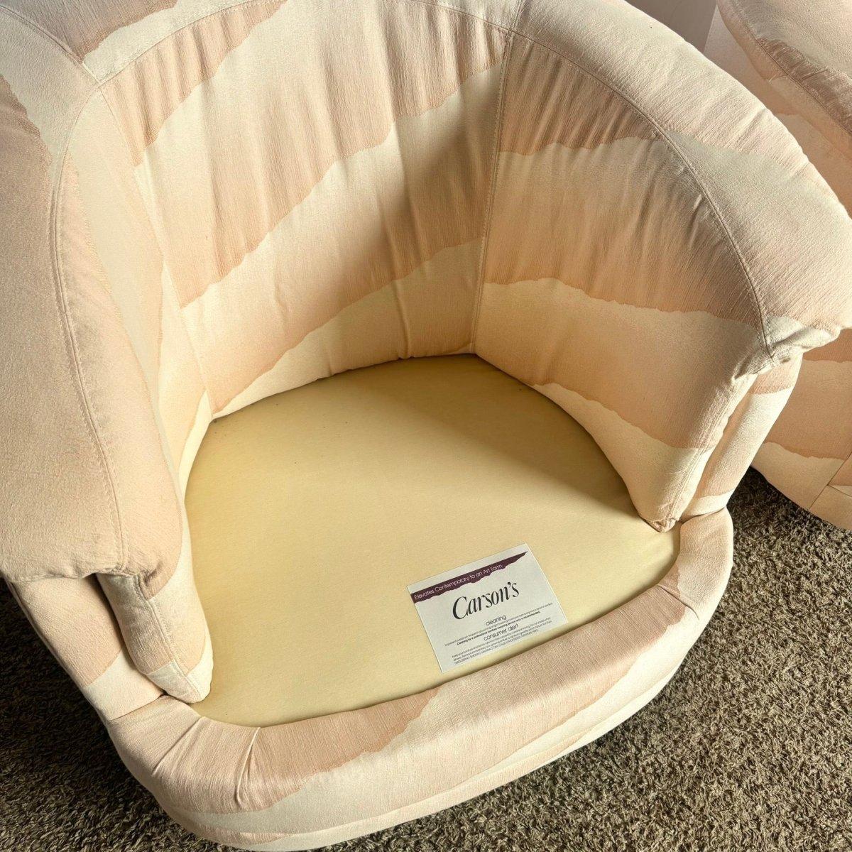 Postmodern Pink Barrel Swivel Chairs bring sculptural retro charm and soft blush elegance to interiors with iconic 1980s-inspired design.
 

 Some discoloration on the arm of one of the chairs as shown in the photos and a mark on the bottom side of