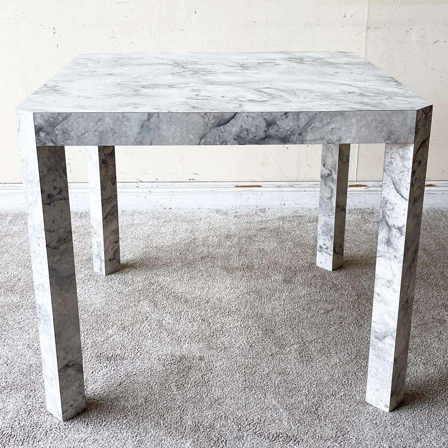 Incredible vintage postmodern square dining table. Features a white and gray faux marble gloss laminate with legs that are flush to each corner. 