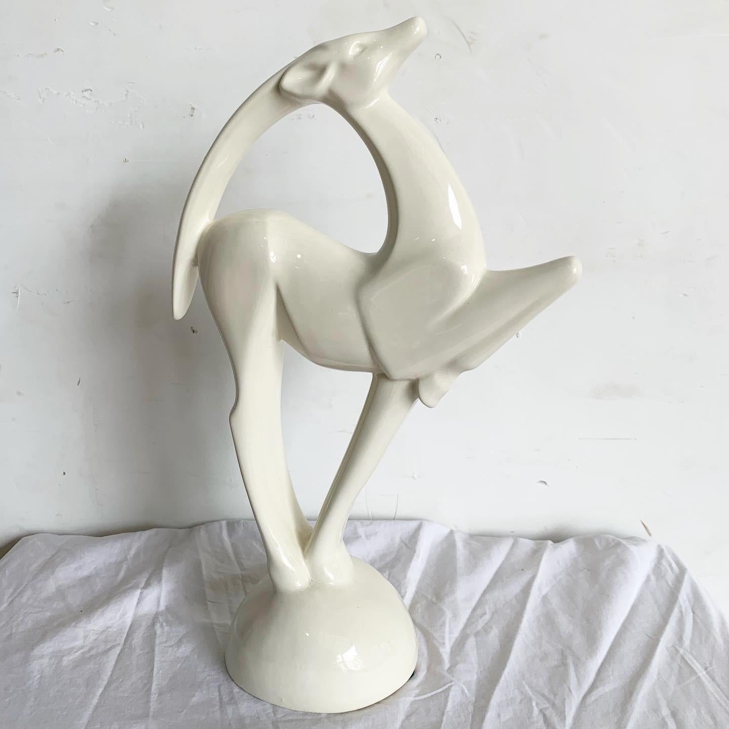 Introducing the Haeger White Ibex Sculpture, a perfect fusion of timeless elegance and modern design. Cast in pristine white ceramic, this postmodern piece captures the Ibex's majesty through sleek lines and stylized detailing. Haeger's commitment