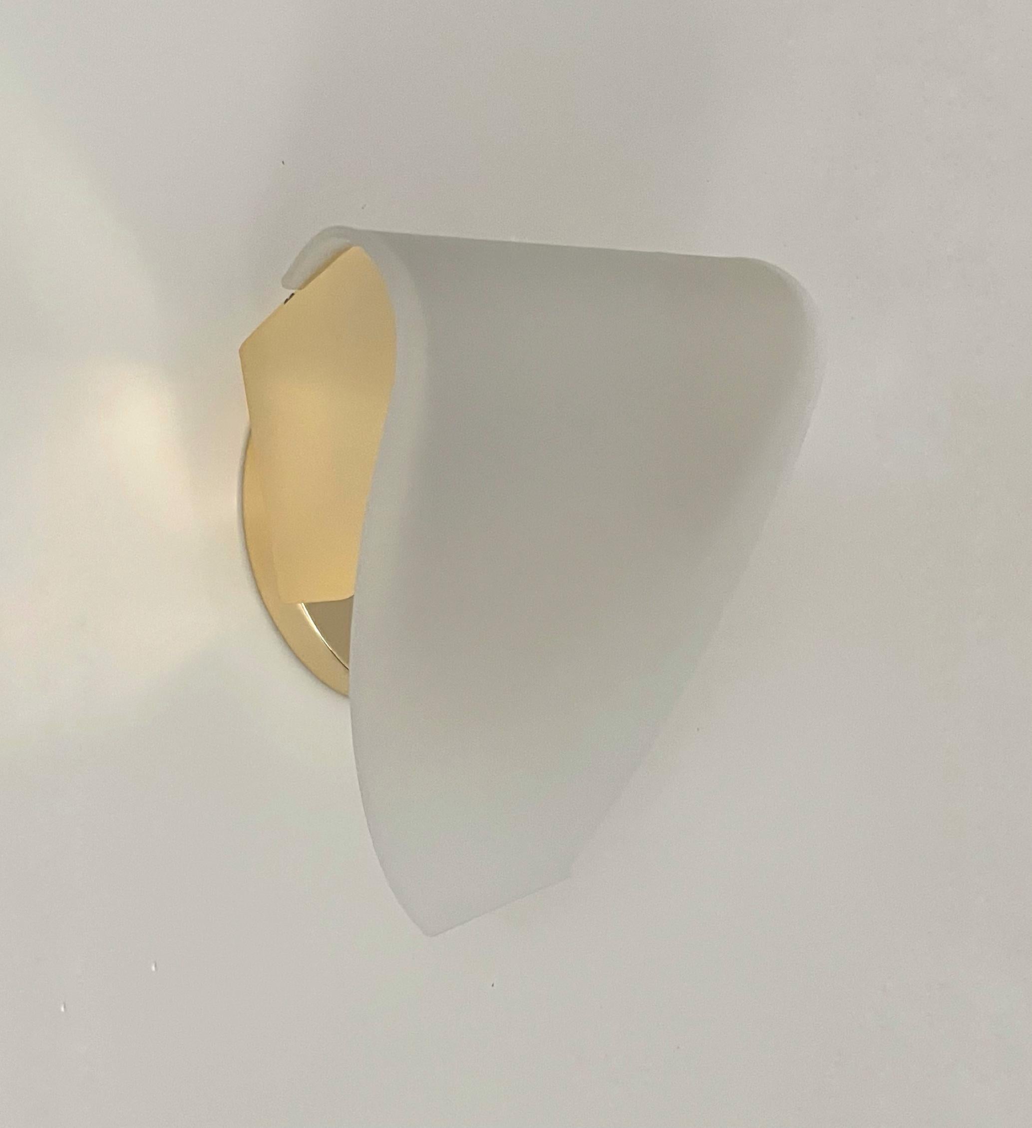Pretty Postmodern Spanish Pair of Gold metal White glass Wall Sconces by Blauet. Model: Maria 210 Gold/White. These Wall Lights were made in Barcelona (Spain) by Blauet during 1990s.
They have never been used, the condition is excellent. “Blauet”