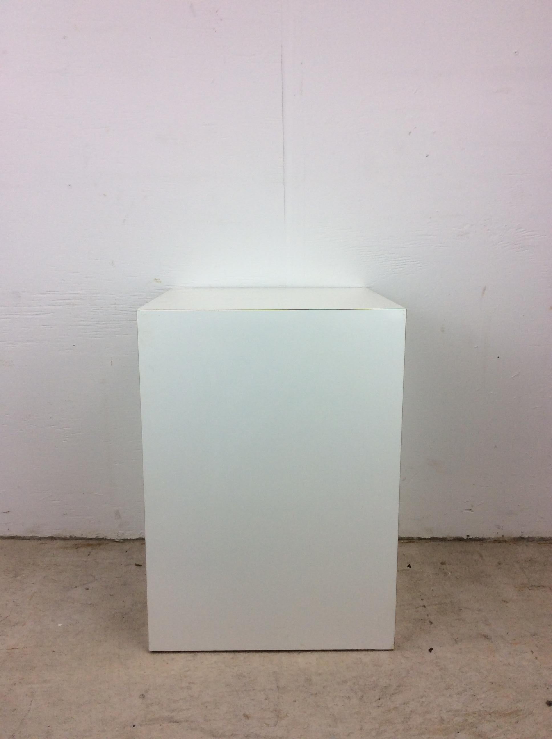 This post modern decorative pedestal features original white lacquer finish on five sides.  

Check out our other listings for more post-modern style furniture pieces. 

Dimensions: 15w 15d 21h

Condition: The original white lacquer finish has some