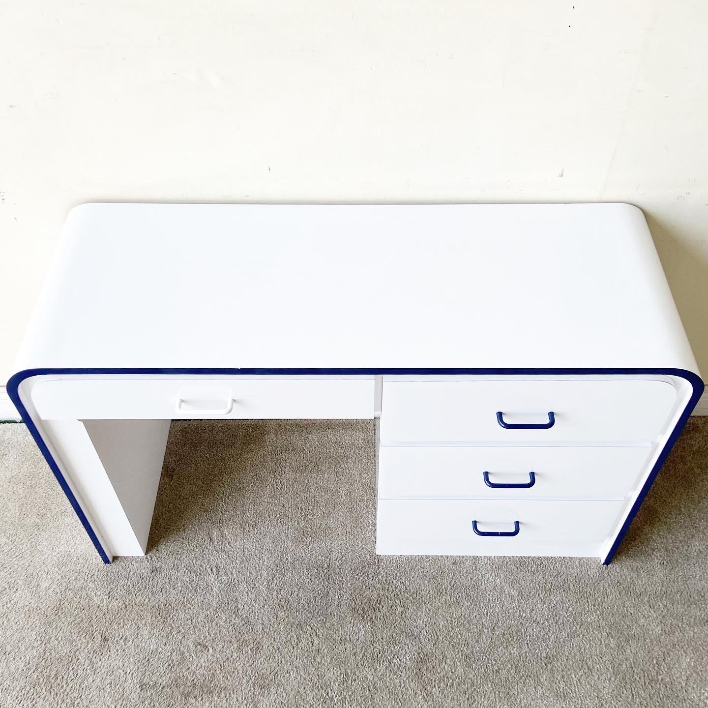 Exceptional postmodern white and blue lacquer laminate waterfall desk. Features 4 spacious drawers with white and blue drawer pulls.
 