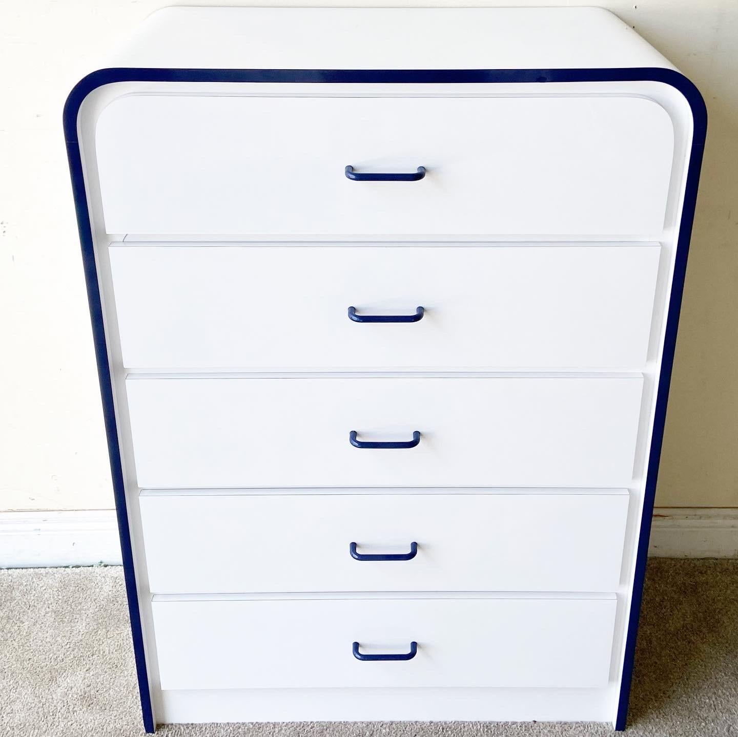 Exceptional postmodern waterfall Highboy dresser. Features a white and blue lacquer laminate with blue drawer pulls.
  