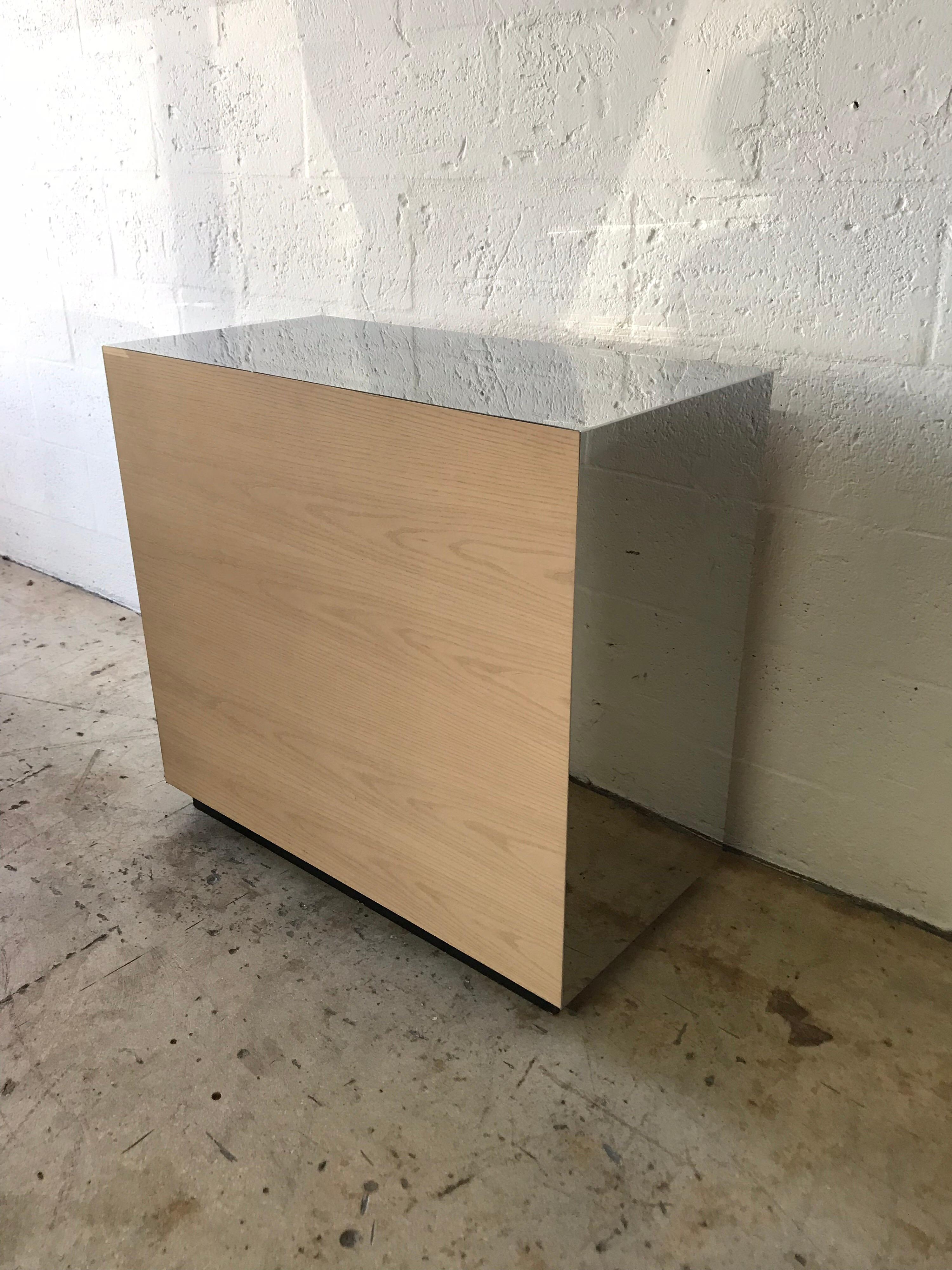 Post modern block console rendered in white oak and mirror polished stainless steel, 1990s