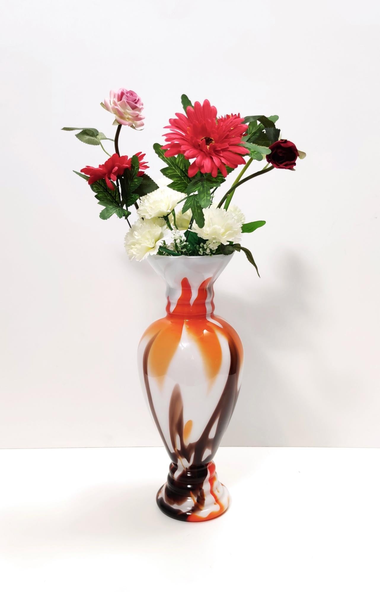 Made in Italy, 1970s. 
This vase is made in Murano glass.
It might show slight traces of use since it's vintage, but it can be considered as in perfect original condition and ready to become a piece in a home. 

Measures: 
Diameter 17 cm
Height 43.5