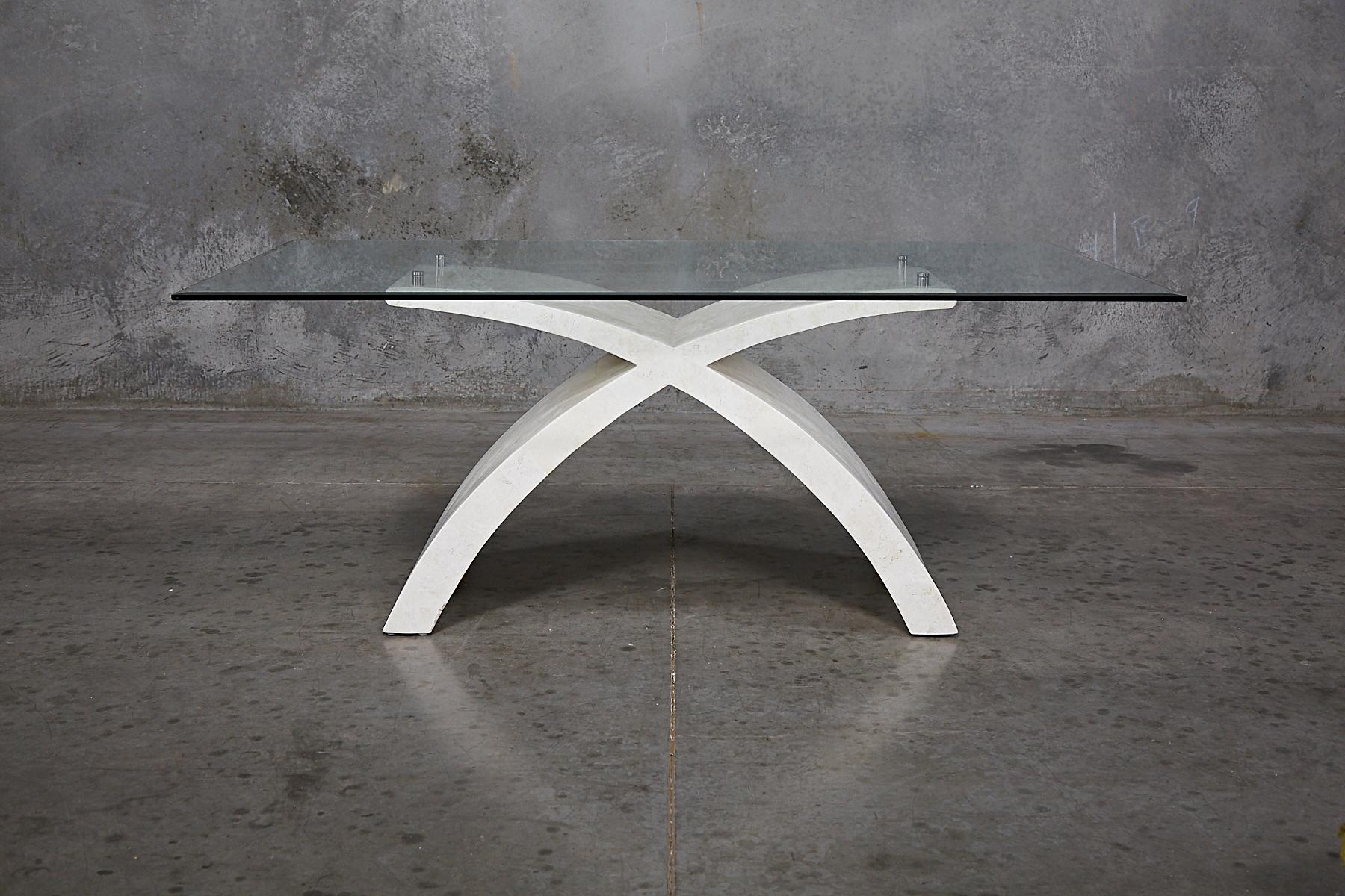 Tessellated white stone hand-inlaid over a fiberglass body. X-shaped base supports a rectangular glass top with stainless steel fittings.

All furnishings are made from 100% natural Fossil Stone or Seashell inlay, carefully hand cut and crafted