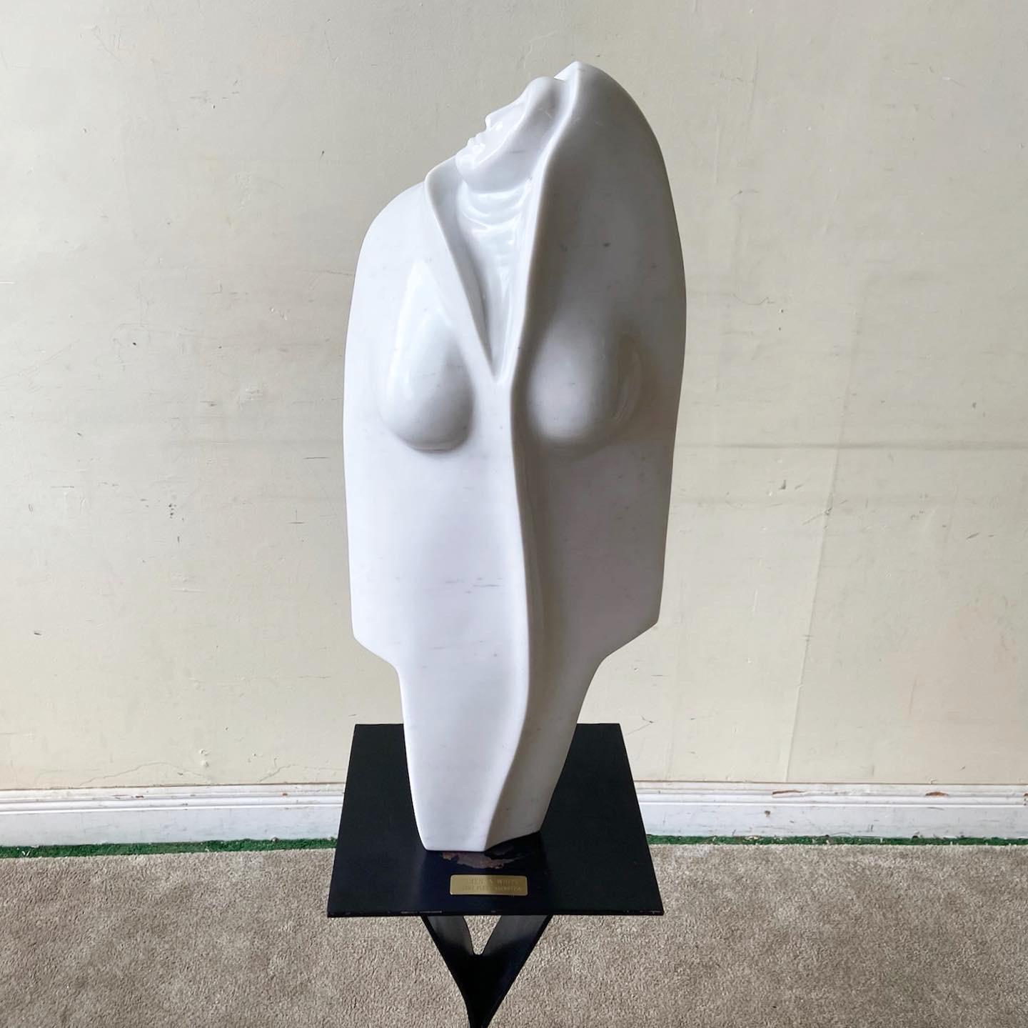 Exceptional postmodern white marble sculpture. Titled “Woman in White”, is displays an abstract female figure looking upward.
