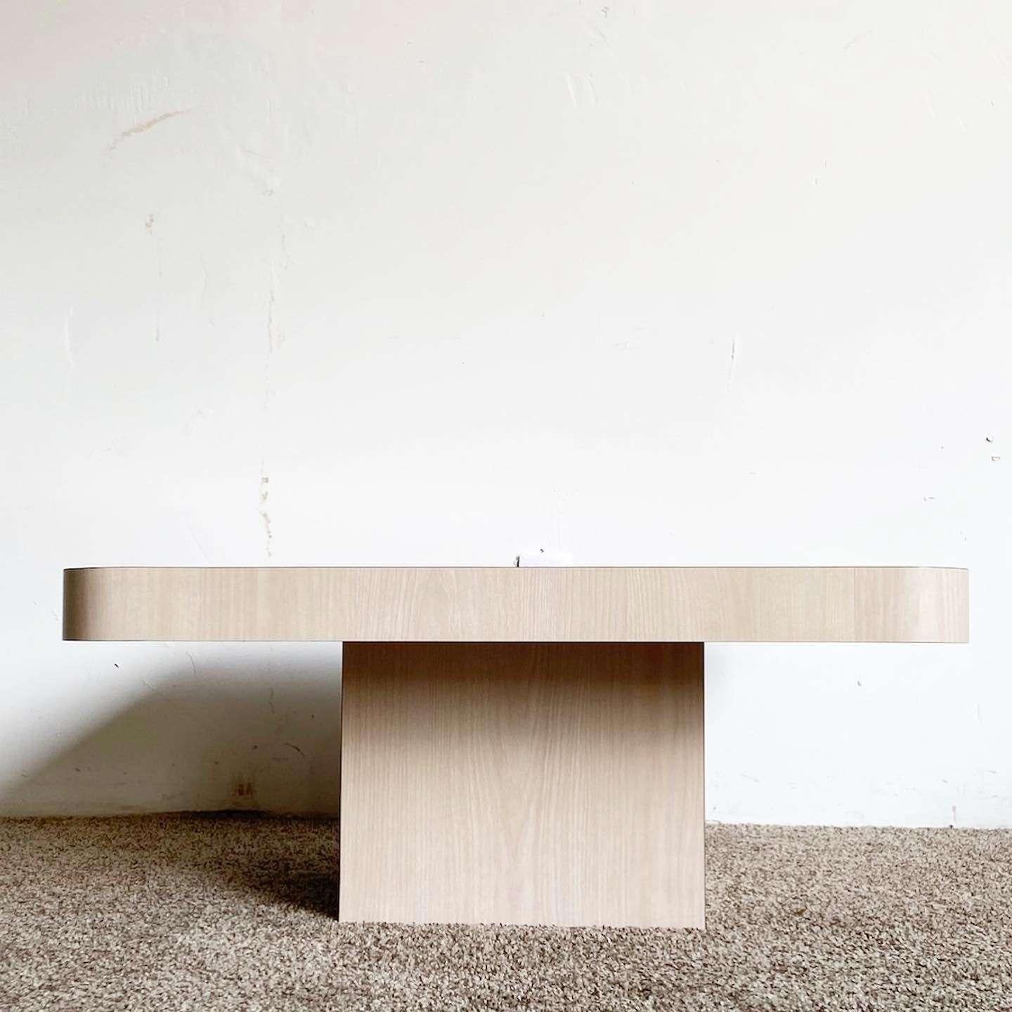 Exceptional vintage postmodern square top mushroom coffee table. Features a washed Woodgrain laminate.