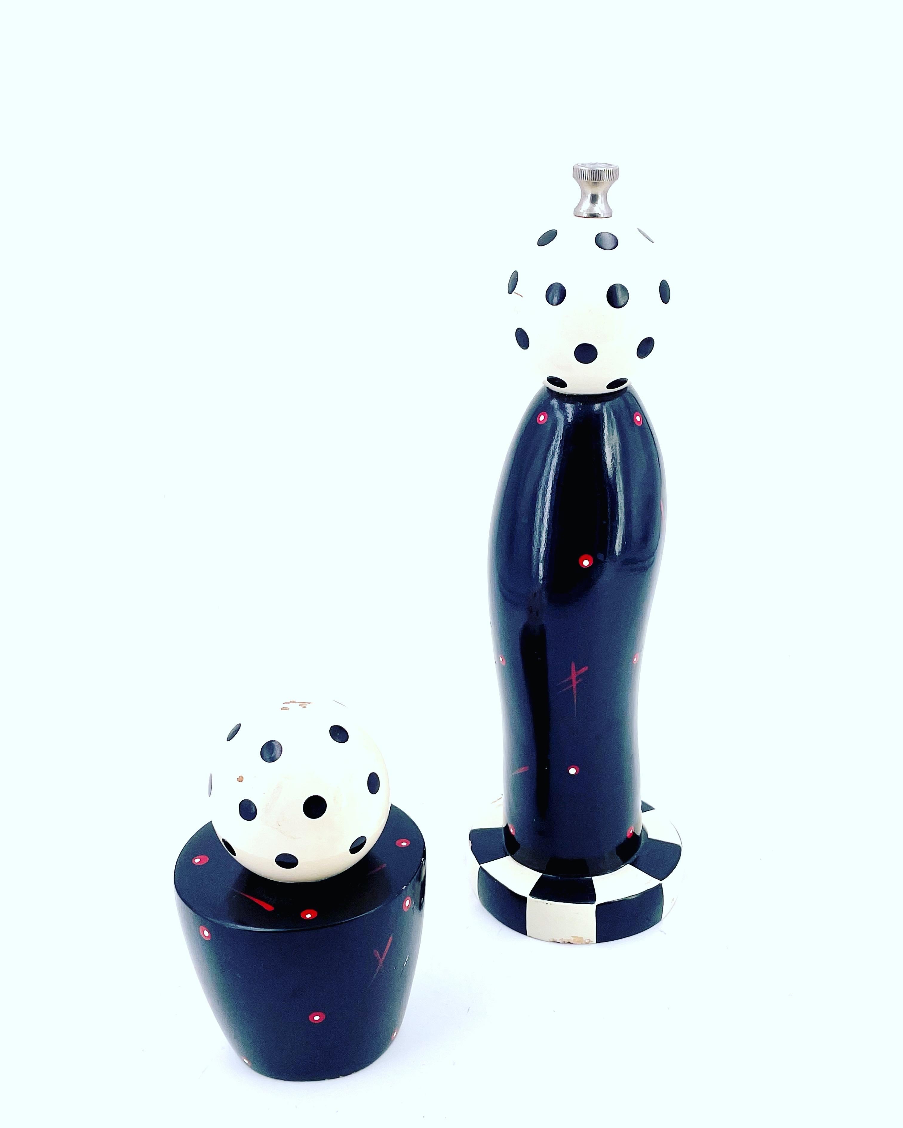 Whimsical salt & Pepper shakers with a flairs of 1980's Memphis era look signed at the bottom.