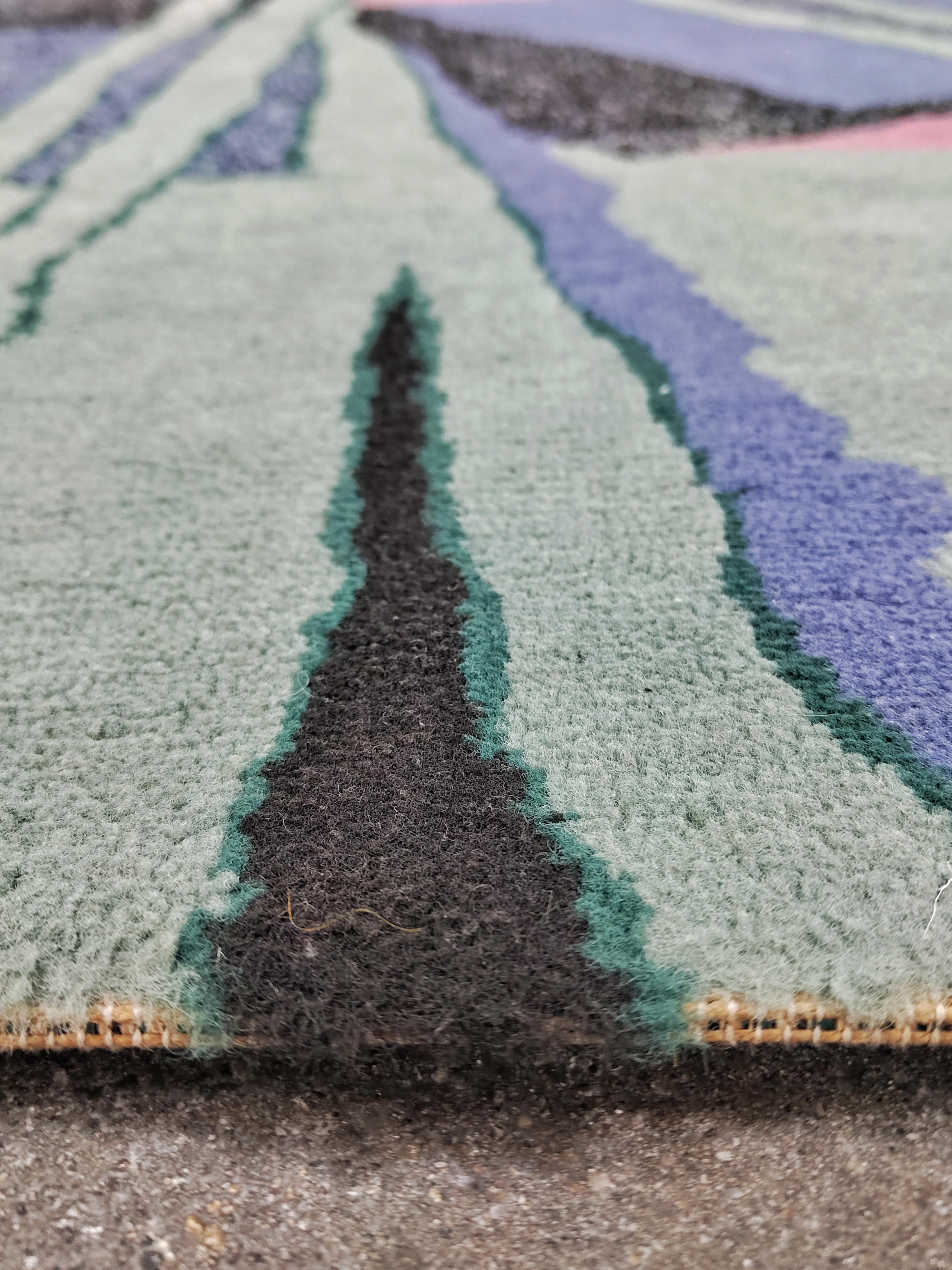 In this listing you will find a beautiful postmodernist rug. It features pastel palette of colours and an abstract pattern. Machine woven, 100% made of wool. It has no manufacturer's label attached. Very well preserved, with minor signs of time and