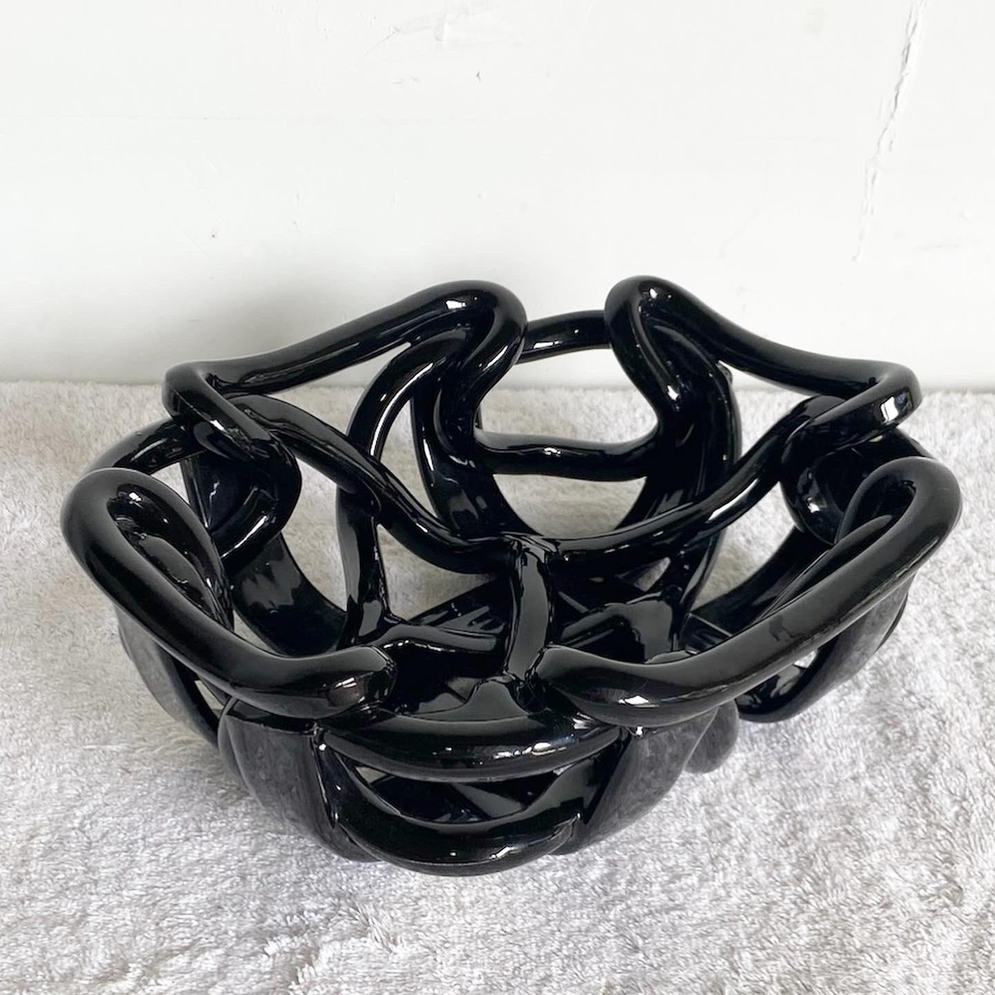 Introducing the exceptional Vintage Postmodernist Black Ceramic Decorative Bowl. Crafted in Italy, this remarkable piece showcases a glossy black finish over a beautifully sculpted open bowl, embodying the postmodern aesthetic.

Exceptional vintage