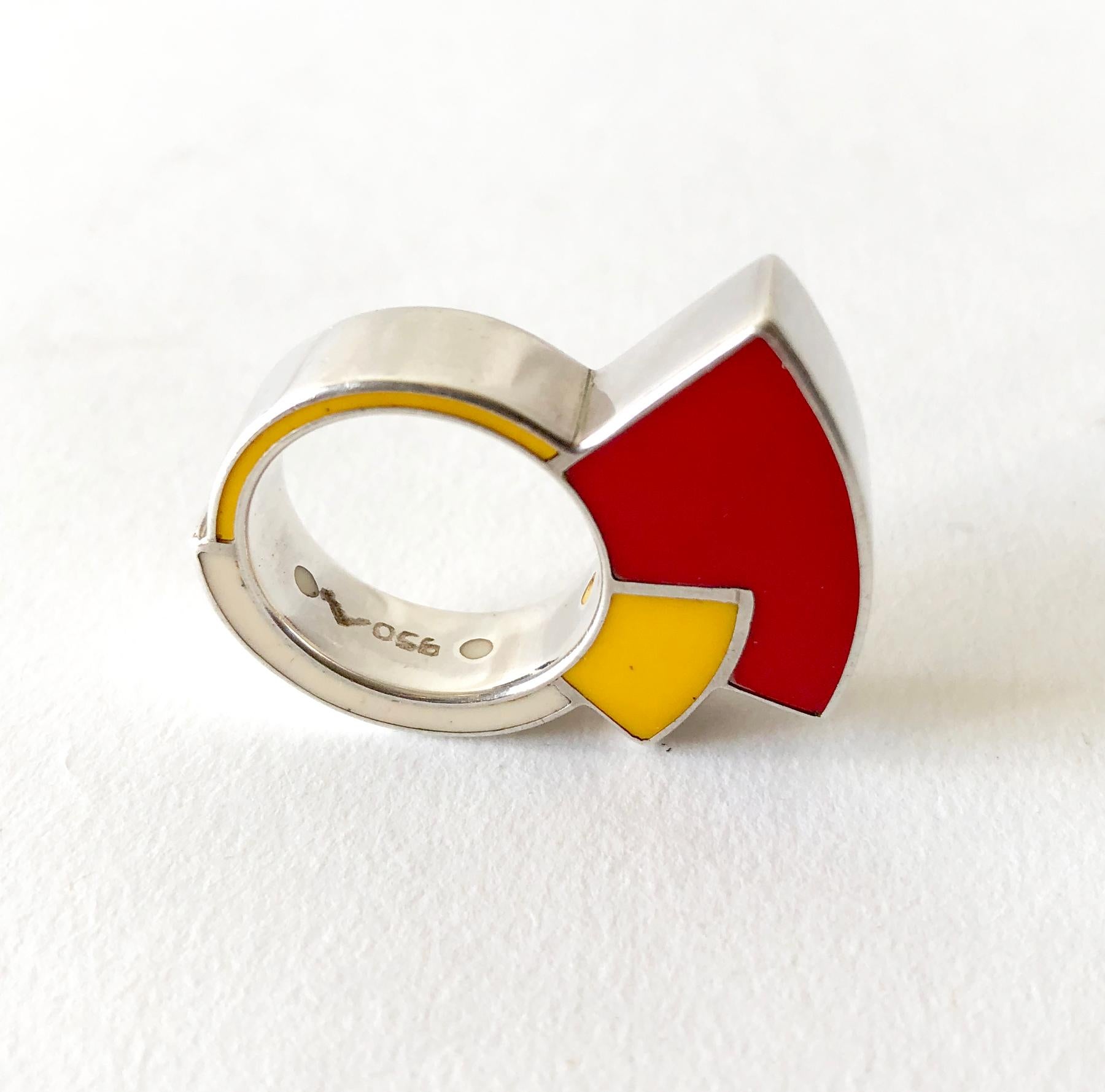 Post modern sterling silver and enamel ring, made in Italy circa 1980's.  Ring is a finger size 6.75 to 7.  It is signed 950 for sterling content with an artists mark of a stylized 