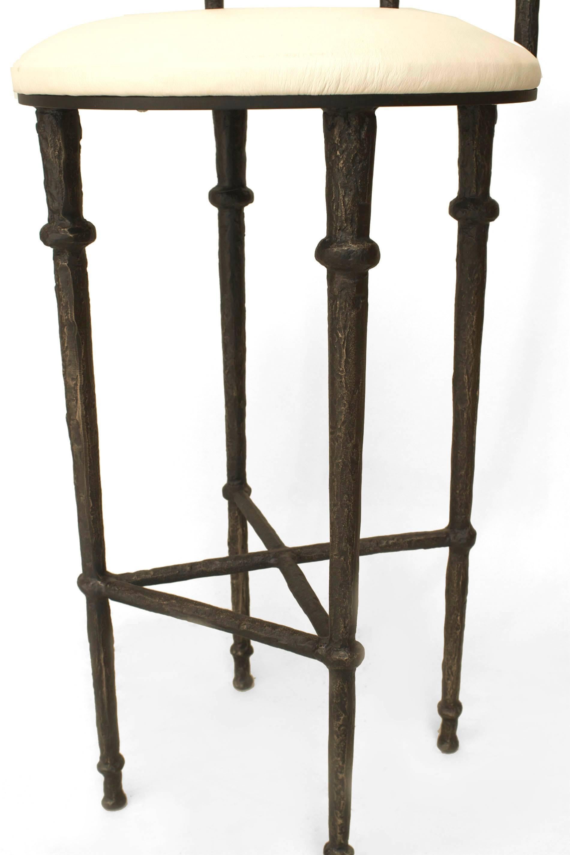 Postwar design (Giacometti style) (Modern) textured dark bronze patina round back bar stool with a white seat (30