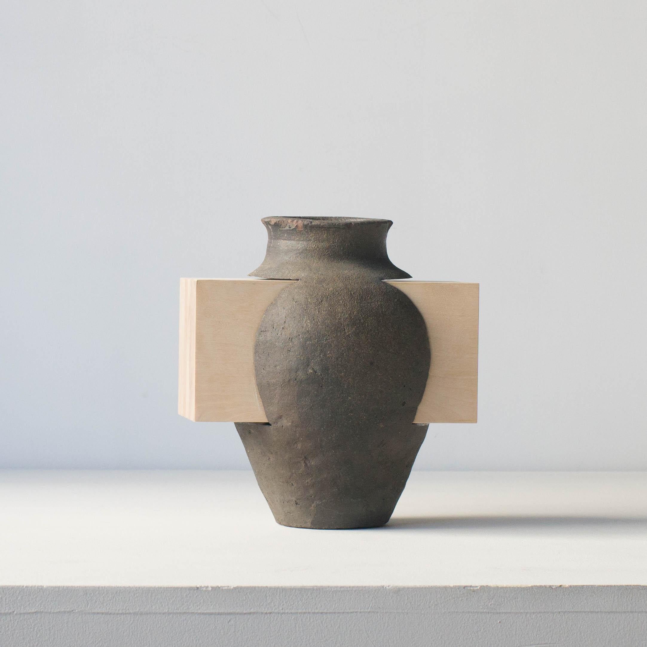 This series of ceramics are unique work by Norihiko Terayama. 
This is one of series of practicing relationships with function and decoration. Artist tried to make decoration that defeats function vase originally had.
This unique piece has wood