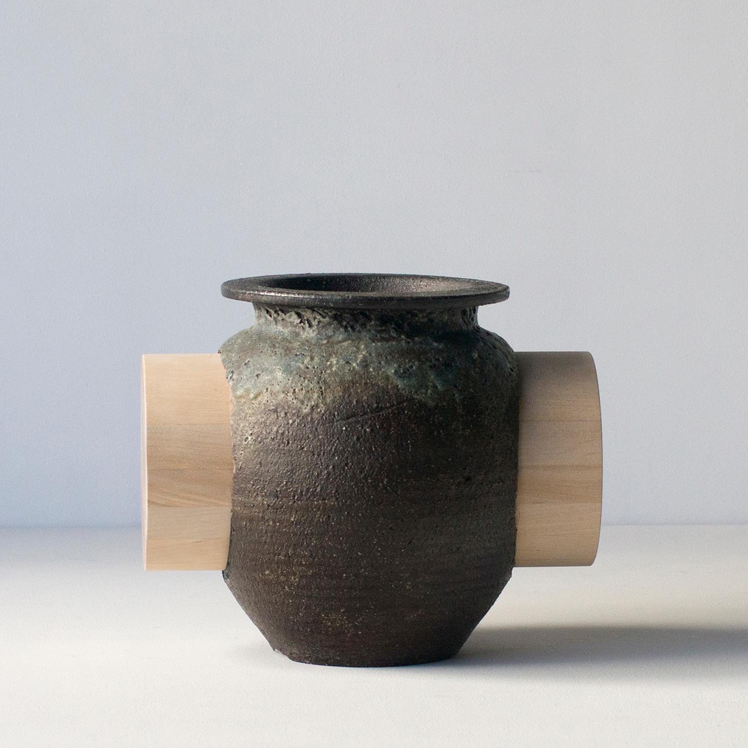 This series of ceramics are unique work by Norihiko Terayama. 
This is one of series of practicing relationships with function and decoration. Artist tried to make decoration that defeats function vase originally had.
This unique piece has wood