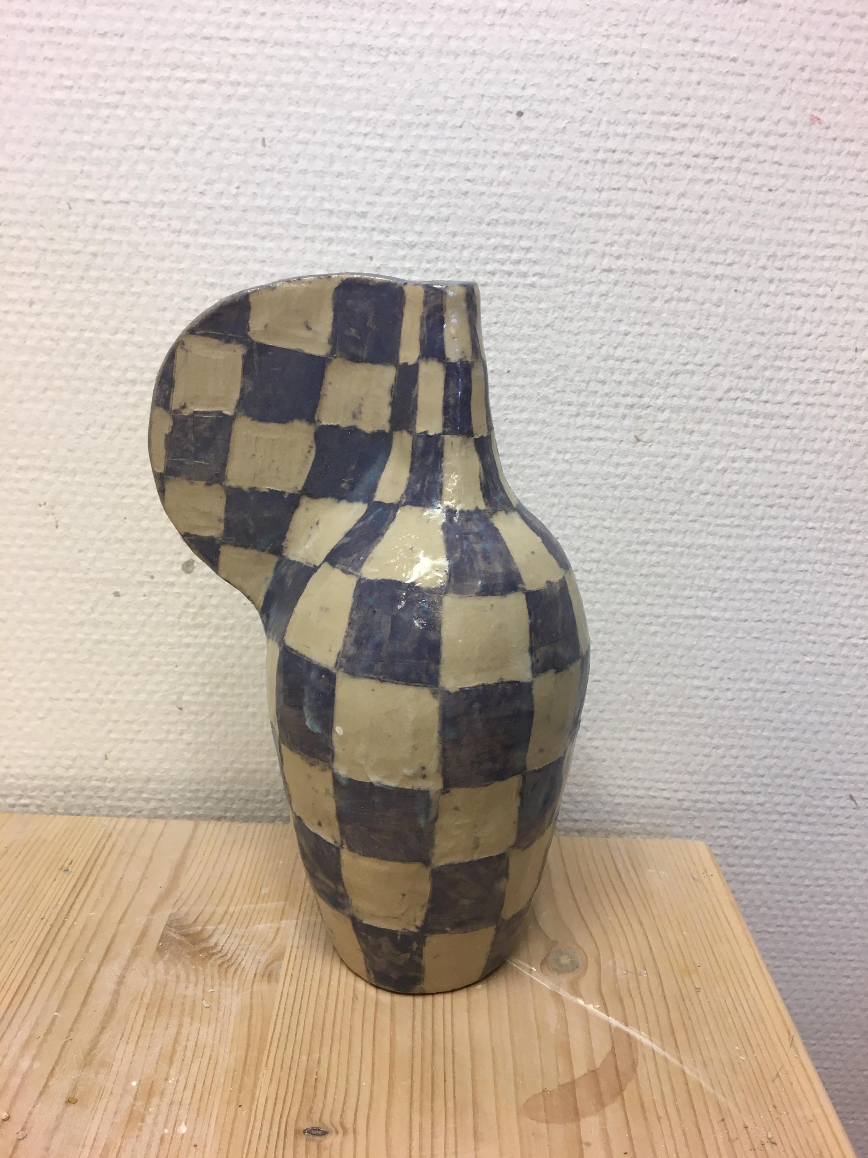Potion bottle by Maria Lenskjold
Dimensions: H 24 cm
Materials: Stoneware

Maria Lenskjold’s practice is based on a consistent principle; to investigate and interact with the common pictorial artistic categories and challenge them in playful and