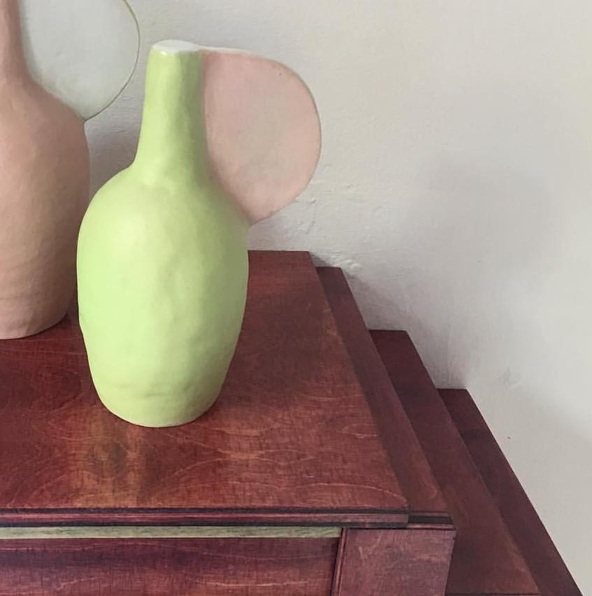 Potion bottle green vase by Maria Lenskjold
Dimensions: H 23 cm
Materials: Stoneware

Maria Lenskjold’s practice is based on a consistent principle; to investigate and interact with the common pictorial artistic categories and challenge them in