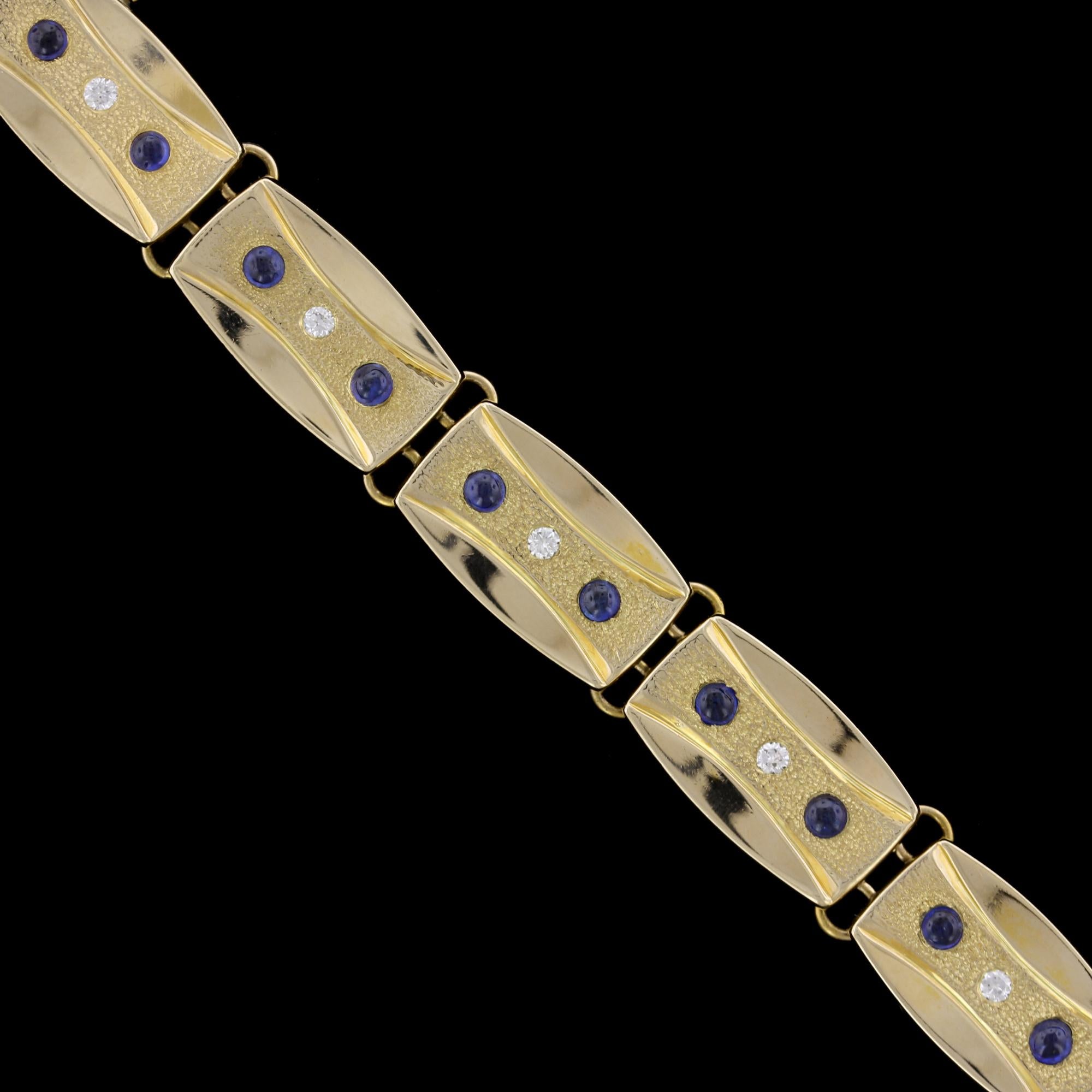 Potter & Mellen 14K Yellow Gold Sapphire and Diamond Bracelet. The bracelet is designed with textured and polished links flush set with 18 cabochon sapphires, approx. total wt. 1.00cts., and nine full cut diamonds, approx. total wt.  .27cts., I
