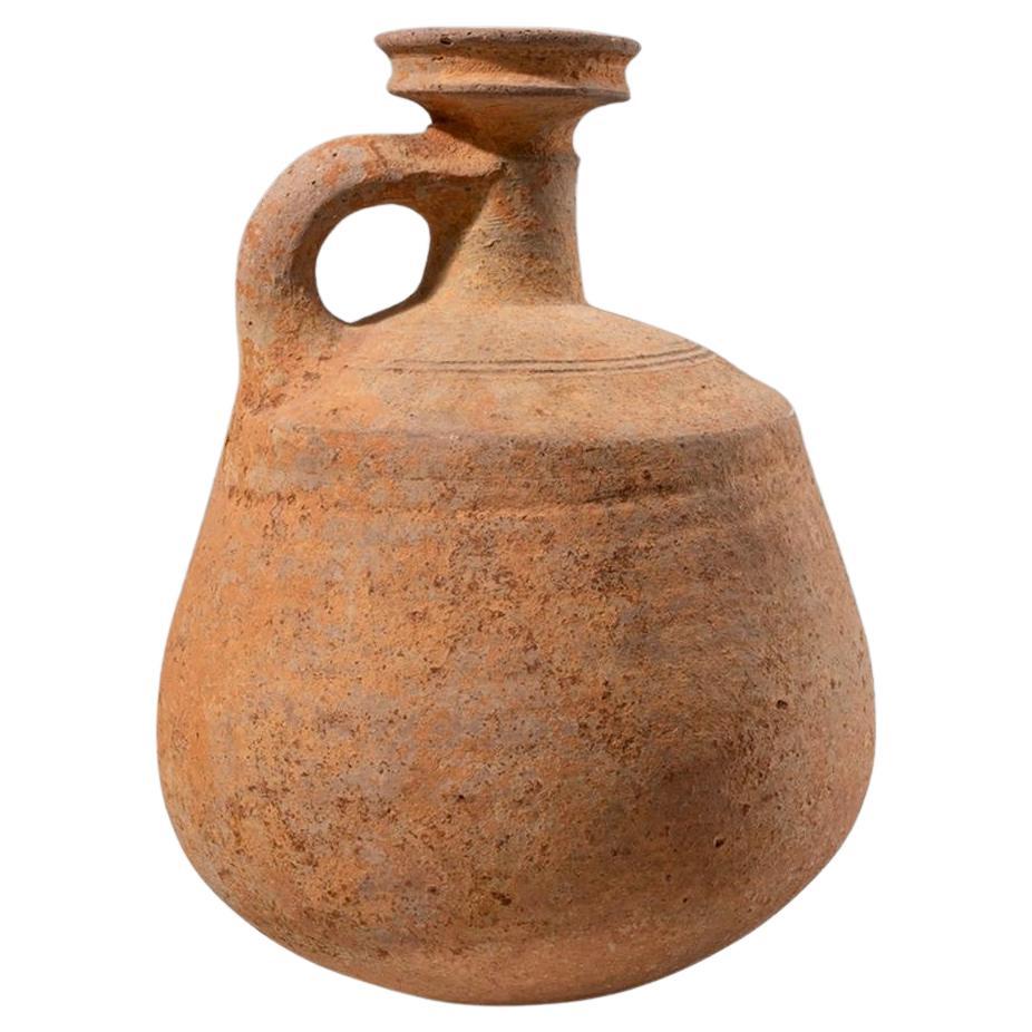 Ancient Holy Land Iron Age Pottery Jug c.1000 BC. 
Fine large pottery footed jug with loop type handle, etched lines at shoulder. Iron Age from the time of King David. 
Provenance: Ex Robert Haber Ancient Art NYC. 
