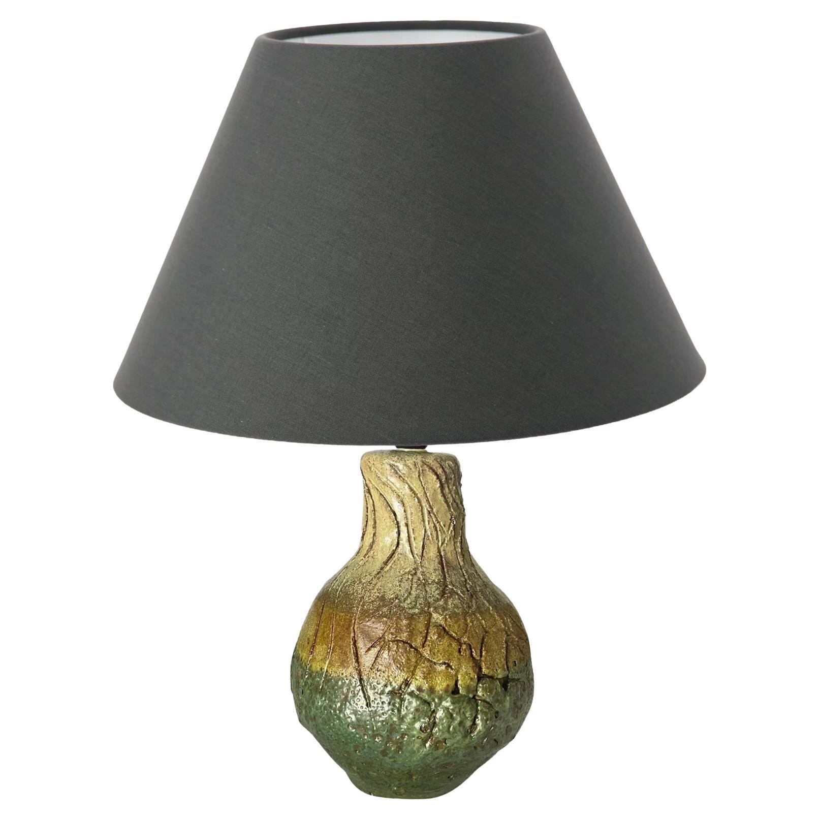 This table lamp is in Pottery. The color is Green It has been made circa 1960, in France.

US PLUG ADAPTATOR WILL BE FURNISHED FOR FREE TO THE US BUYERS
Shade is not Furnished

