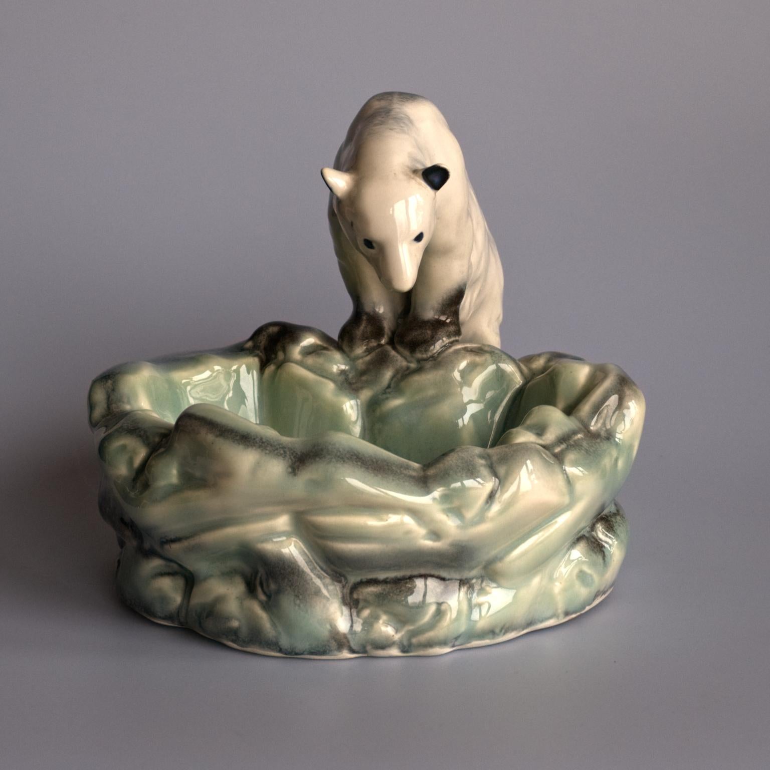 Polar bear at ice POOL, a ceramic bowl manufactured by Ditmar Urbach in Czechoslovakia in the 1930s. The bowl was designed to celebrate Nora, the first polar bear in the Prague Zoo. The piece is marked, Ditmar Urbach made in Czechoslovakia it is in