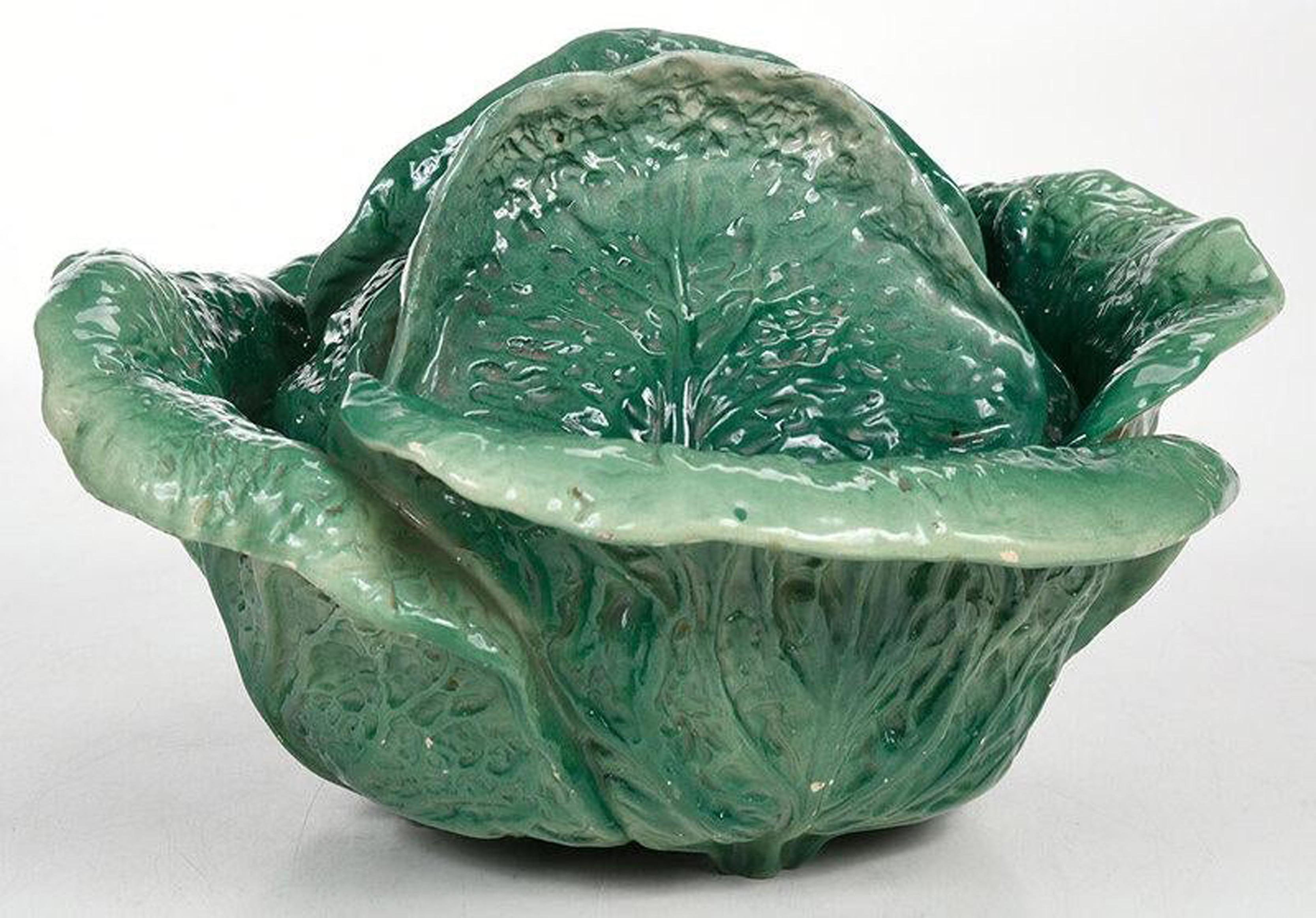 French Pottery Tromp L'oeil creamware cabbage tureen and cover,
18th century


A French tromp l'oeil creamware tureen and cover naturalistically modeled in the form of a cabbage in shades of green. 

Dimensions: 7 inches high x 13 inches