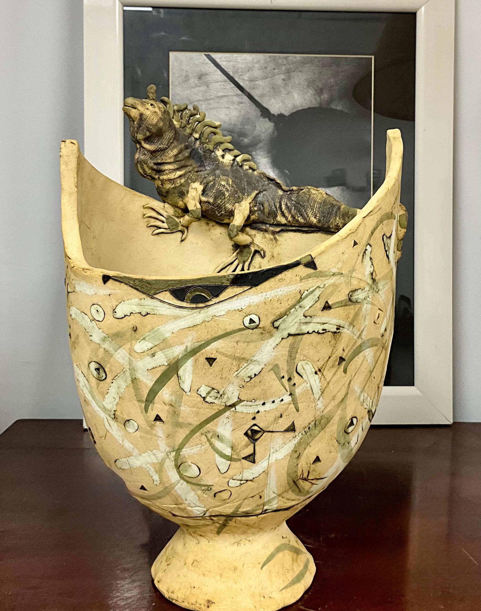 Unique Pottery Vase with Iguana Sculpture

From a collector's estate in Miami, this pottery vase features an iguana sculpture on its rim, highlighting the artist's skill in form and function. The vase showcases earthy tones and organic shapes,