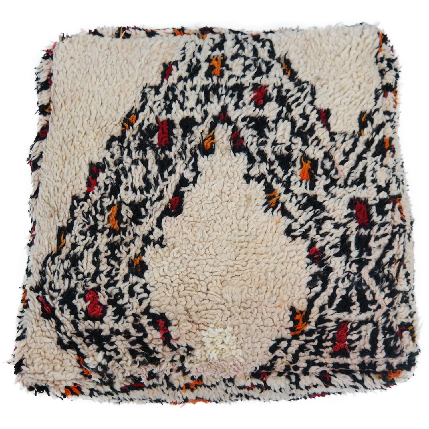 Make your space completely unique with this gorgeous pouf, custom made from a beautiful authentic circa 40 years old Beni Ourain rug. Adding a cozy and sophisticated touch to your space will be easy with this one-of-a-kind pouf. It is perfect for