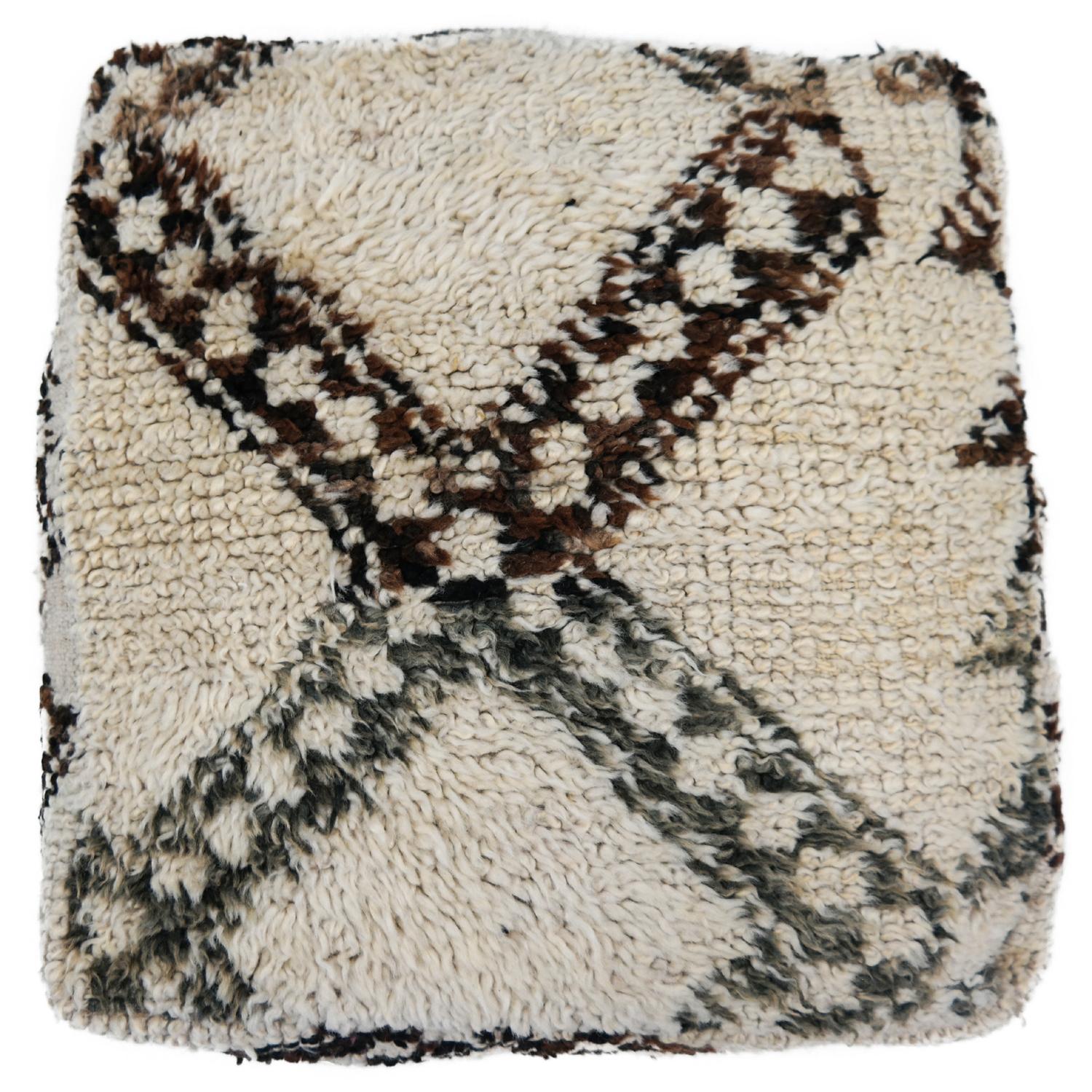 Beni Ourain pouf

Make your space completely unique with this gorgeous custom designed Moroccan Beni Ourain pouf.

This Moroccan pouf is made from a beautiful authentic vintage Beni Ourain rug. The old rugs are beautiful because of their life