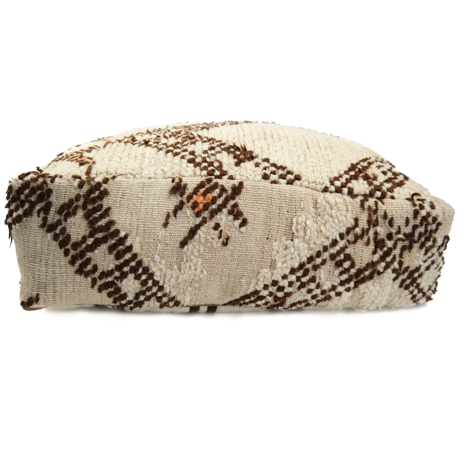 Beni Ourain pouf

Make your space completely unique with this gorgeous custom designed Moroccan Beni Ourain pouf.

This Moroccan pouf is made from a beautiful authentic vintage Beni Ourain rug. The old rugs are beautiful because of their life