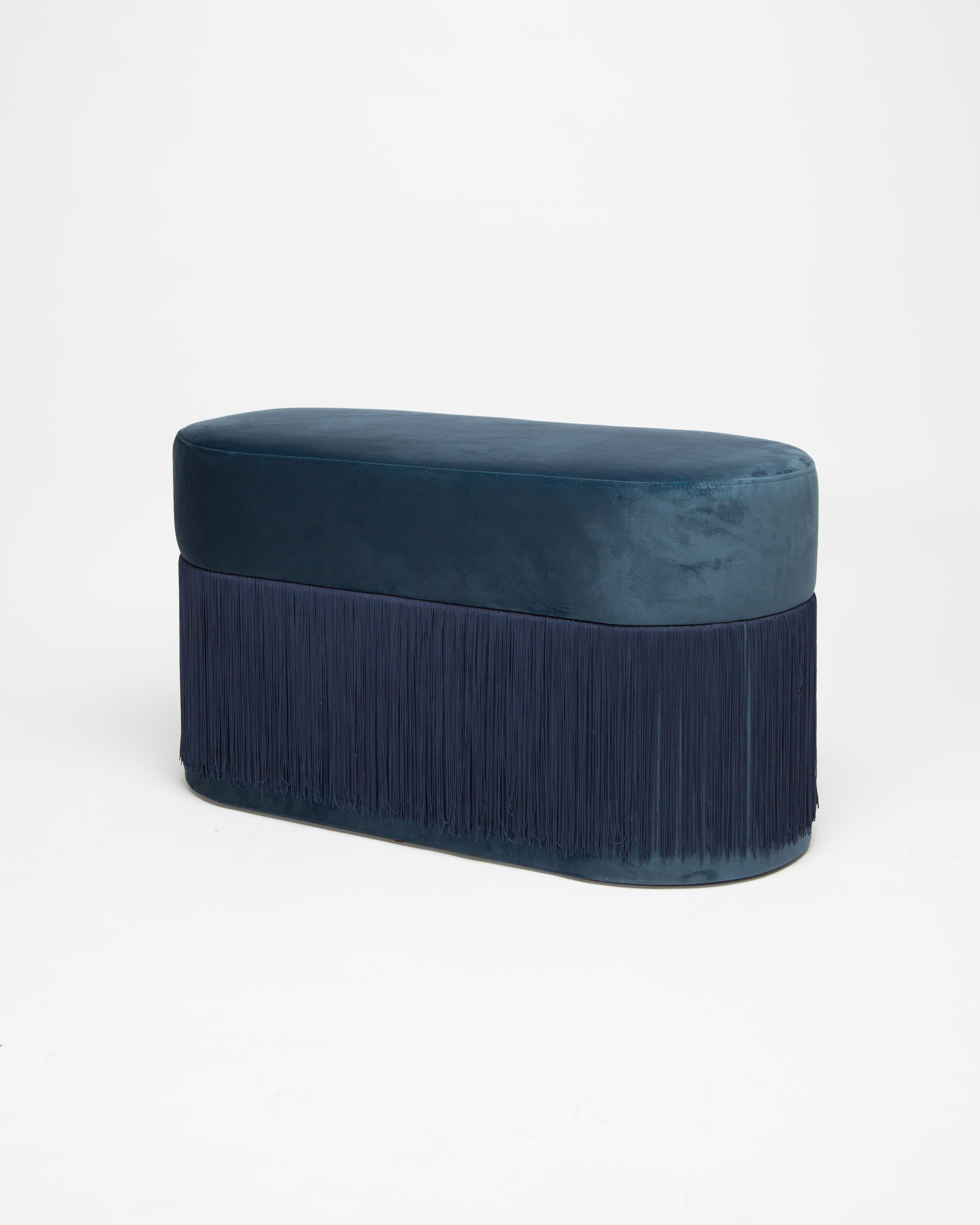 Pouf Pill L by Houtique
Dimensions: H 45 x 80 x 35 cm
Materials: Velvet upholstery and 30cm fringes

Pill Pouf L
Art-deco style pouf with wood structure and velvet fabric.
2 fiber-board discs of 16mm, joined by wooden tufts.
Upholstery Velvet