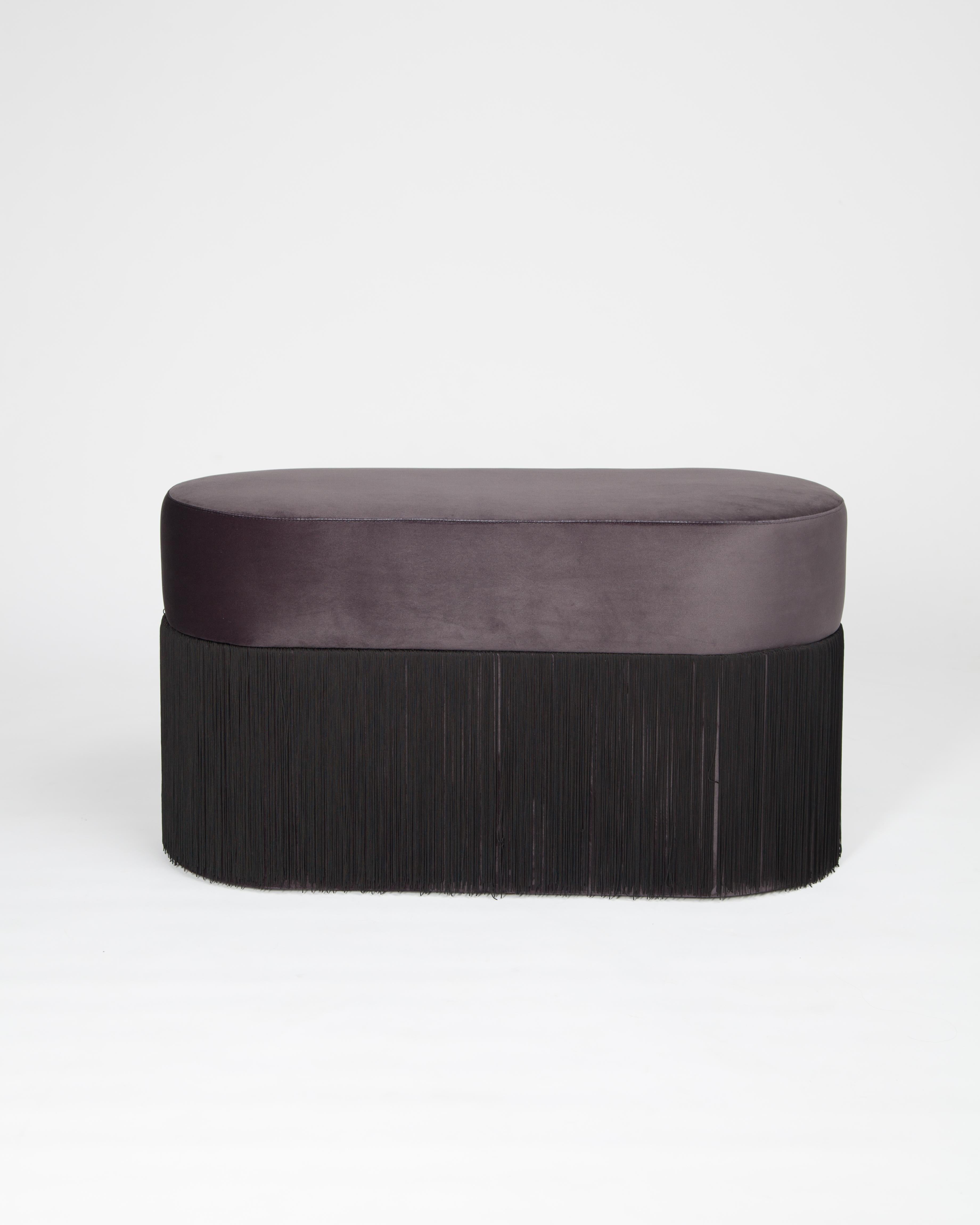 Pouf pill L by Houtique
Dimensions: H 45 x 80 x 35 cm
Materials: Velvet upholstery and 30cm fringes

Pill Pouf L
Art-deco style pouf with wood structure and velvet fabric.
2 fiber-board discs of 16mm, joined by wooden tufts.
Upholstery Velvet