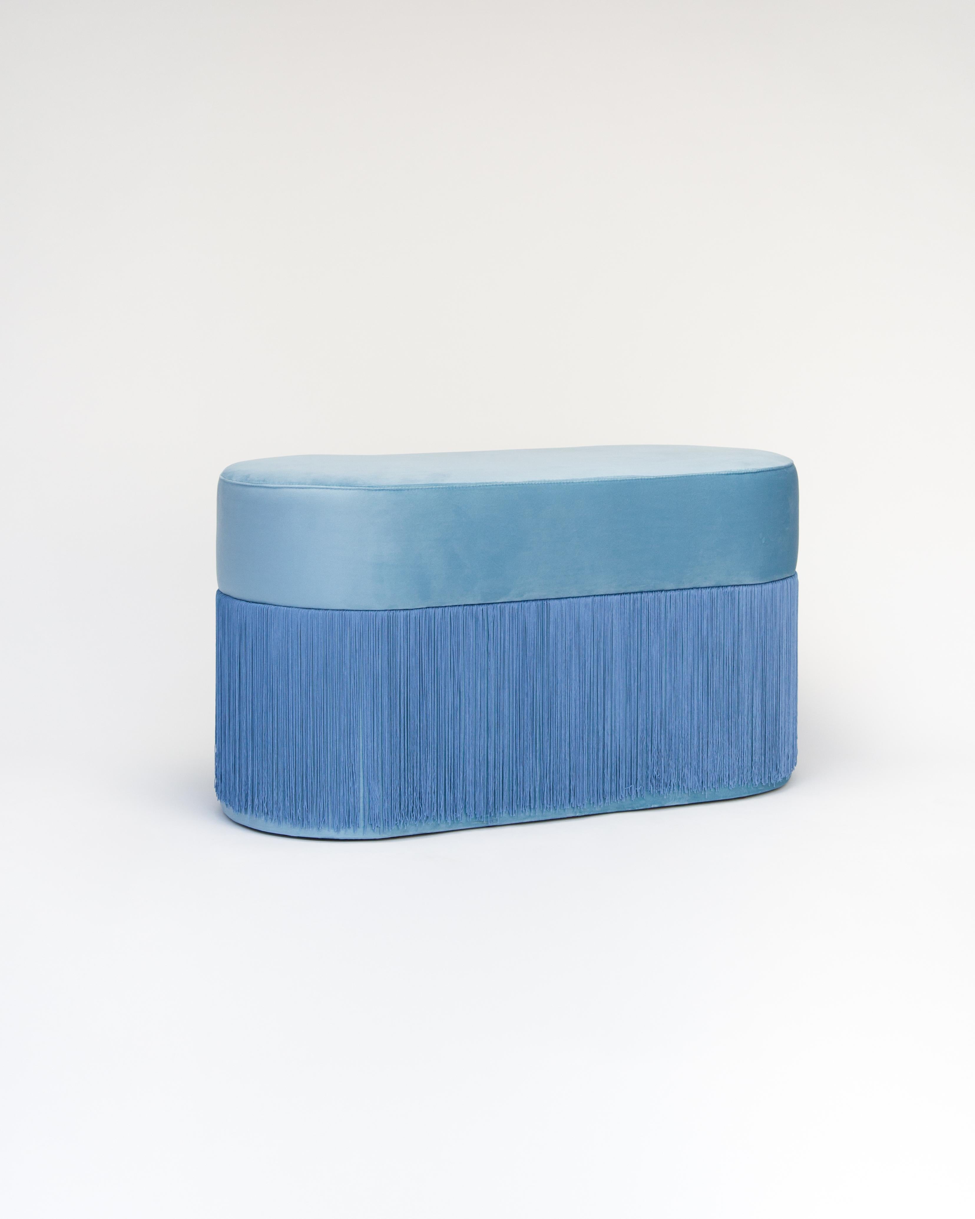 Pouf pill L by Houtique
Dimensions: H 45 x 80 x 35 cm
Materials: Velvet upholstery and 30cm fringes

Pill Pouf L
Art-deco style pouf with wood structure and velvet fabric.
2 fiber-board discs of 16mm, joined by wooden tufts.
Upholstery Velvet