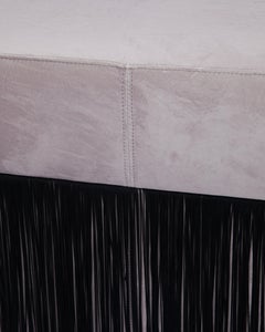 Pouf Pill Large Warm Grey in Velvet Upholstery with Fringes