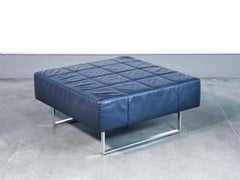 Quadra pouf, designed by Poltrona FRAU, in black leather. Italy, 90s