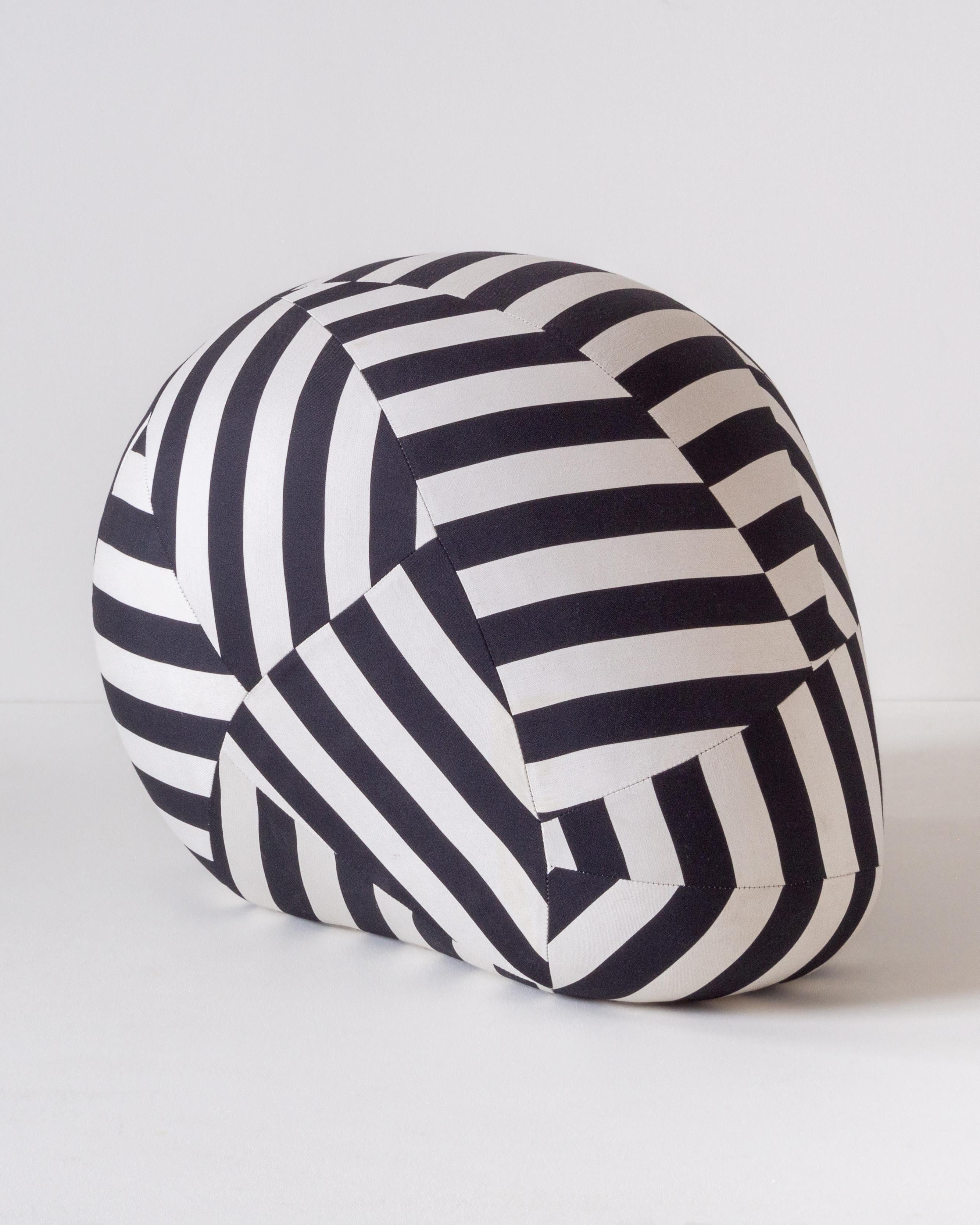 A big and gentle pouf with a distinctive presence, energizing any environment it is put in. Smooth, sculptural, graphic, and bold, it is the result of merging modern technology with ancient manufacturing techniques.

Crafted with precision, a
