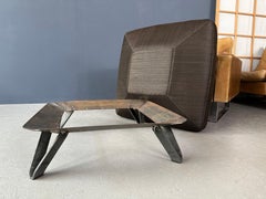 Pouf with a black square pillow and iron legs