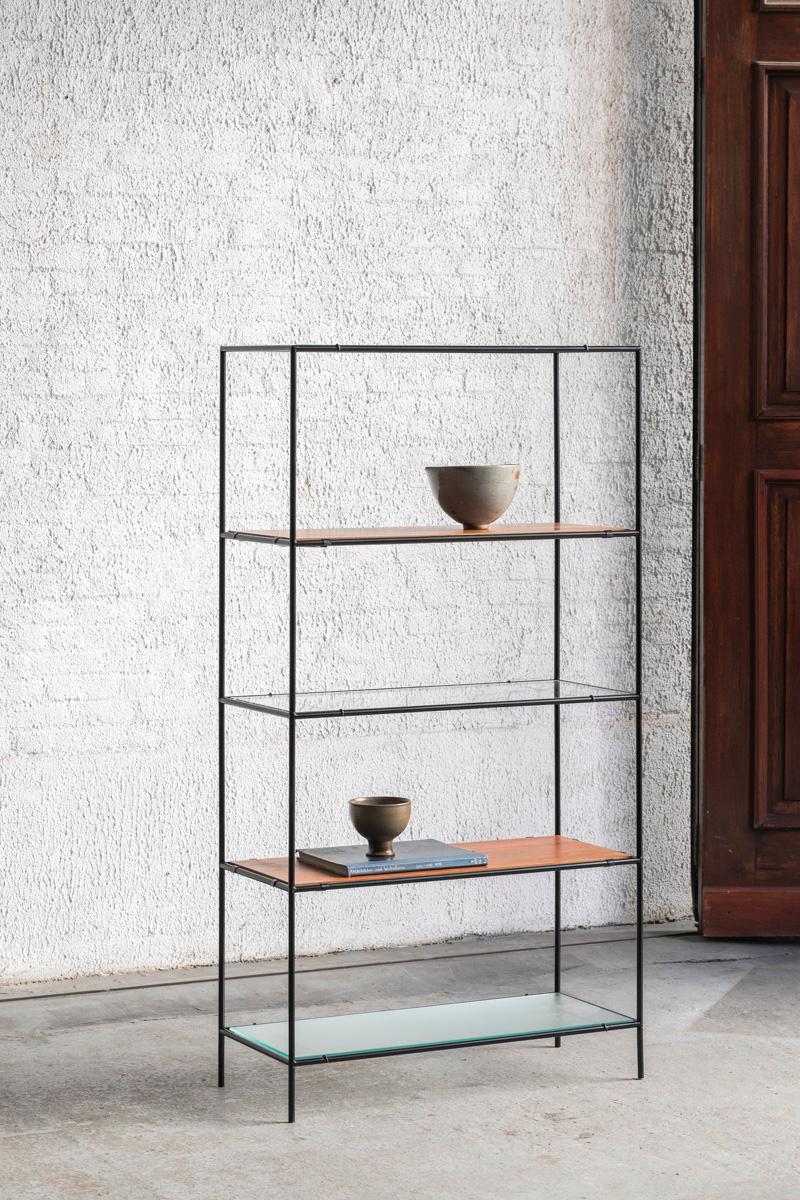 Abstracta shelving unit designed by Poul Cadovius and produced in Denmark around 1960. This unit consist of black lacquered steel pipes, 2 types of glass shelves, and teak veneer shelves. Some slight discoloration on the shelves, further in very