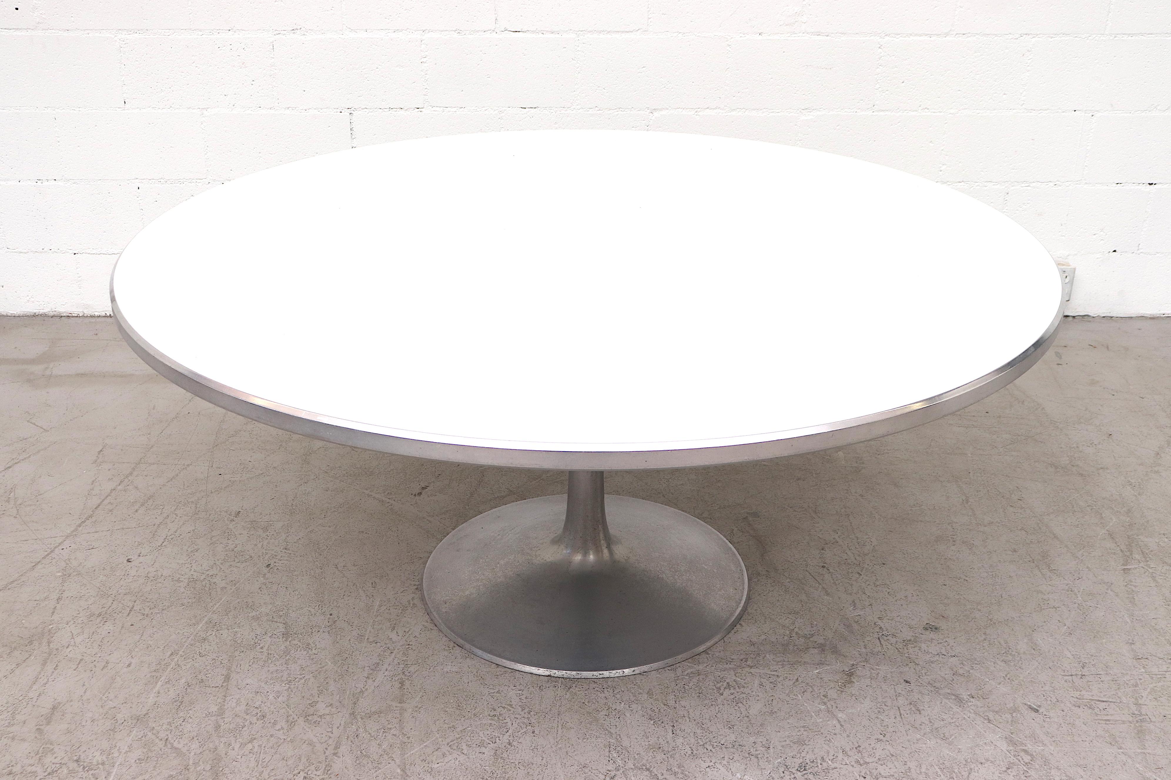 Extra large Poul Cadovius round dining table with aluminum base and edge and white Formica top. In original condition with visible wear to frame and surface. Another smaller Cadovius dining table (LU922418398202) also available and listed separately.