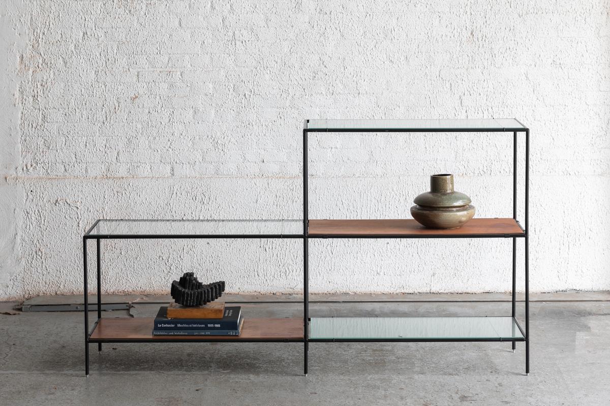 2-Piece Abstracta shelving unit designed by Poul Cadovius in Denmark around 1960. Frame with black lacquered metal pipes and shelves in teak veneer, figured glass and flat glass. This configuration features one low and one high side. The shelves can
