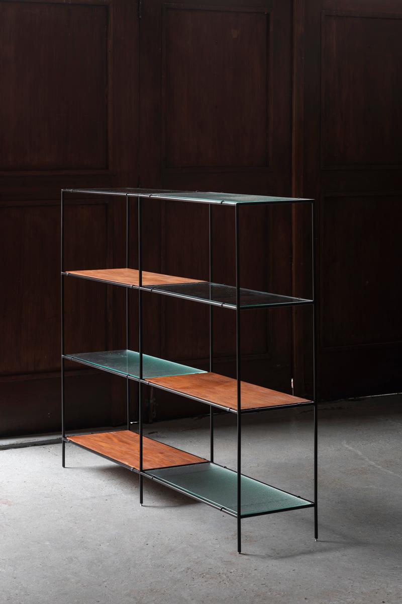 2-Piece Abstracta shelving unit designed by Poul Cadovius in Denmark around 1960. Frame with black lacquered metal pipes and shelves in teak veneer, figured glass and flat glass. The shelves can be arranged as desired. In good condition with some