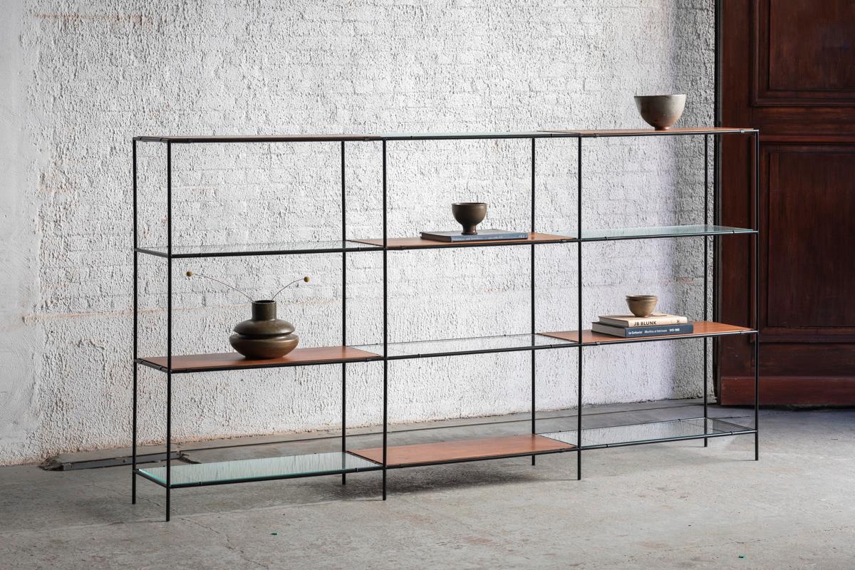 3-Piece Abstracta shelving unit designed by Poul Cadovius and produced in Denmark around 1960. This unit consist of black lacquered steel pipes, 2 types of glass shelves, metal plates and teak veneer shelves. Some discoloration on the teak shelves,